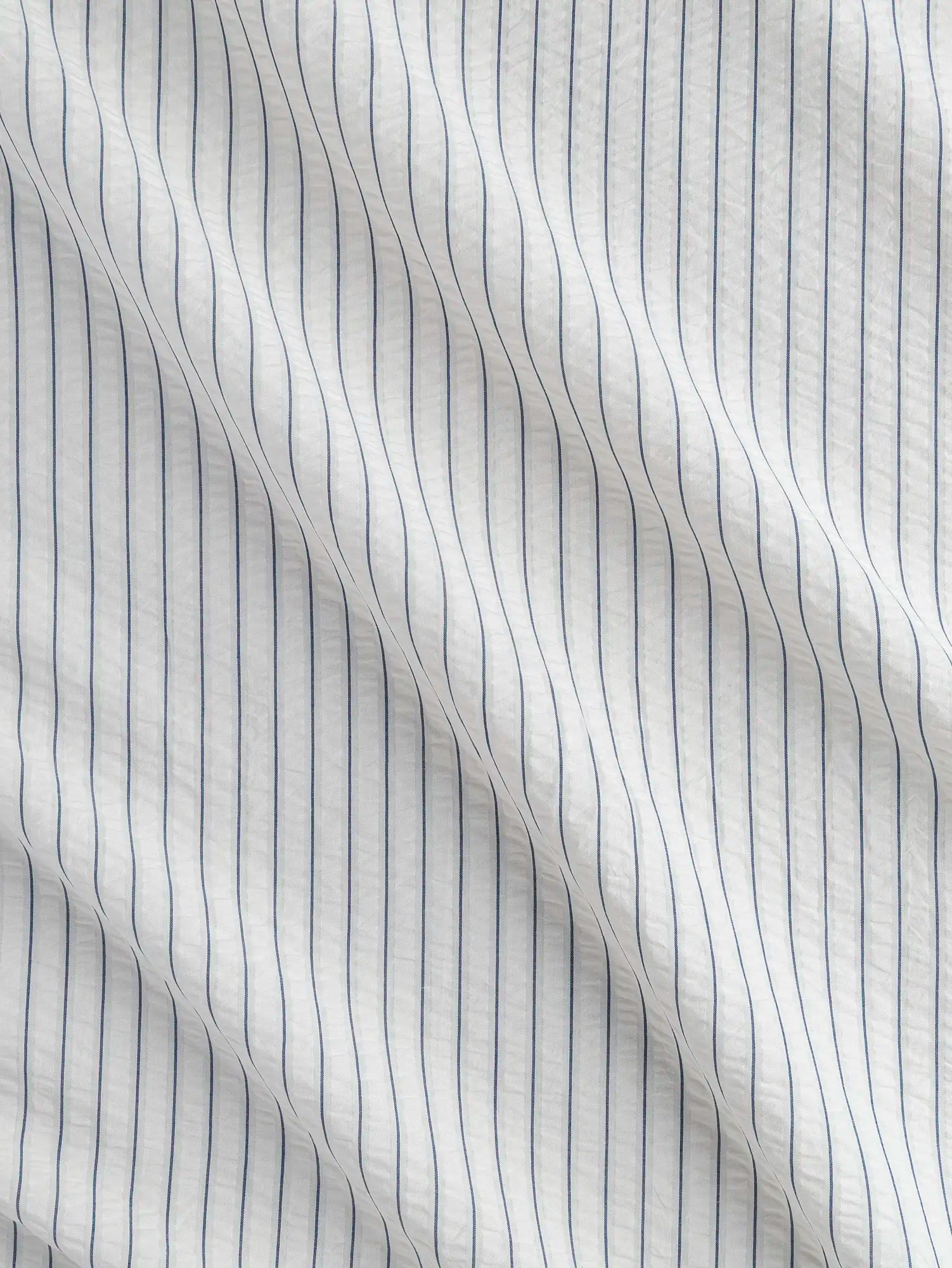 F-COT461-Pinstripe-Cotton-Seersucker-White-and-Indigo-Core-Fabrics-scrunched.webp