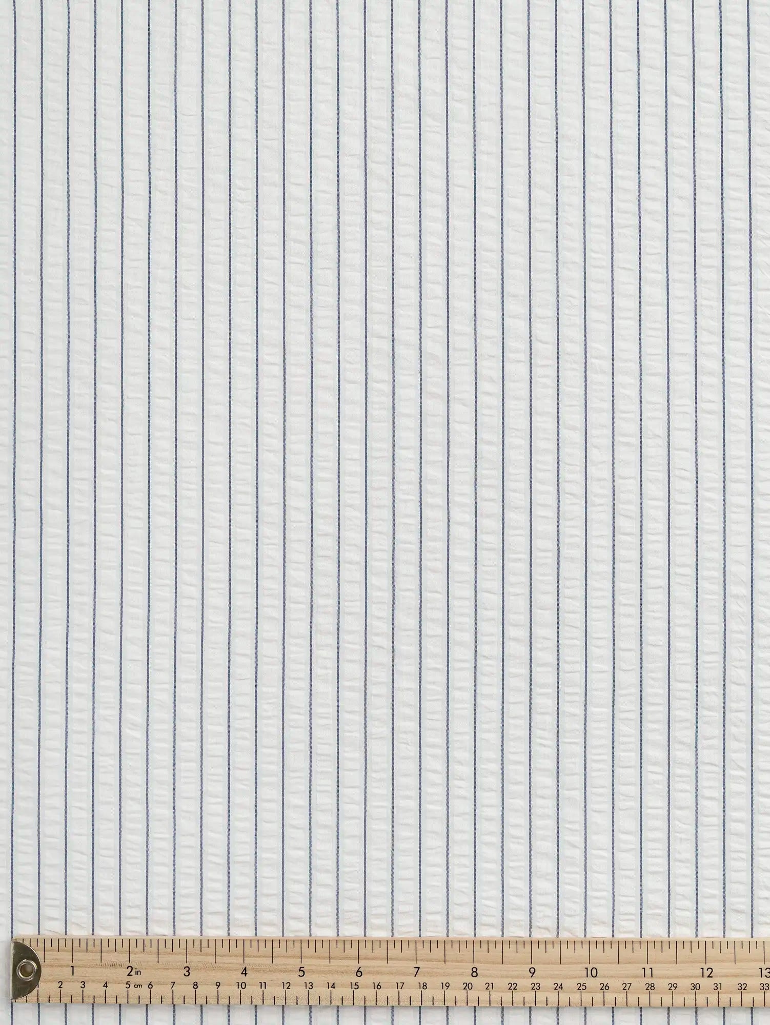 F-COT461-Pinstripe-Cotton-Seersucker-White-and-Indigo-Core-Fabrics-ruler.webp