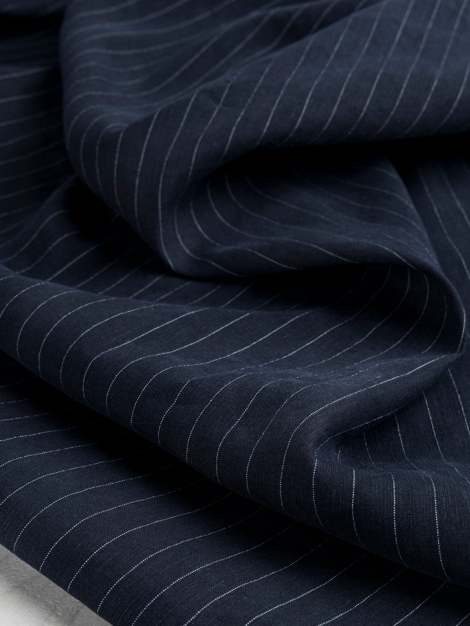 F-DEA075-Pinstripe-Linen-Tencel-Suiting-Deadstock-Navy-White-Core-Fabrics-scrunched-2.JPG
