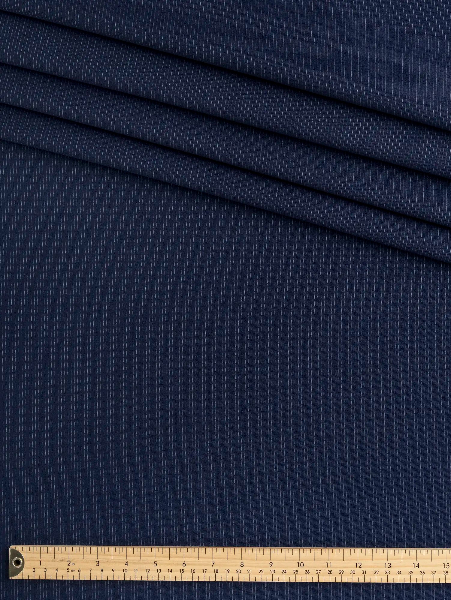 F-WOL160-Pinstripe-Wool-Italian-SuitingDeadstock–Navy-and-Chambray-Core-Fabrics.webp