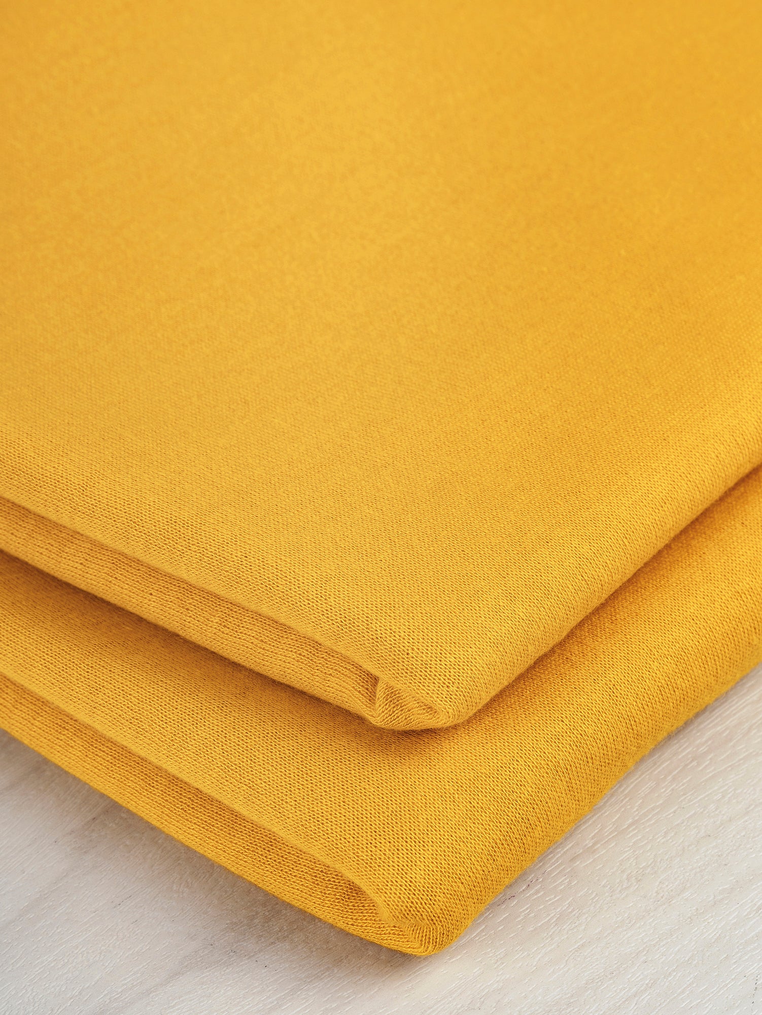 F-DEA048-Pointelle-Double-Knit-Deadstock-Mango-Core-Fabrics-fold.JPG