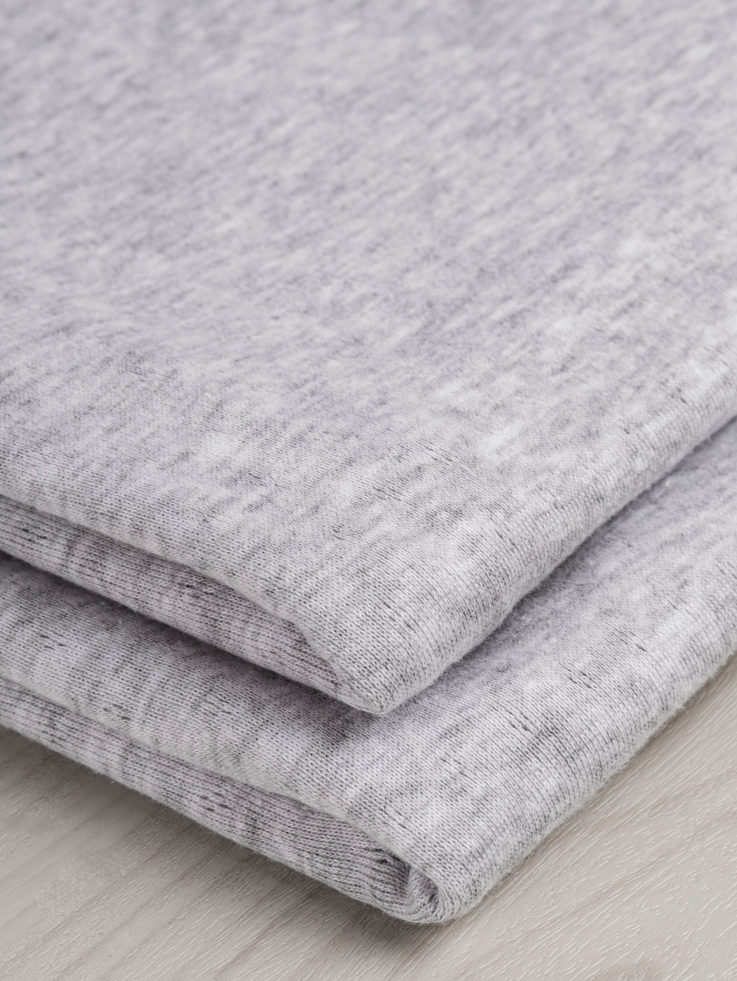 F-COT329-002-Pointelle-Jersey-Knit-Heather-Grey-Core-Fabrics-fold.JPG