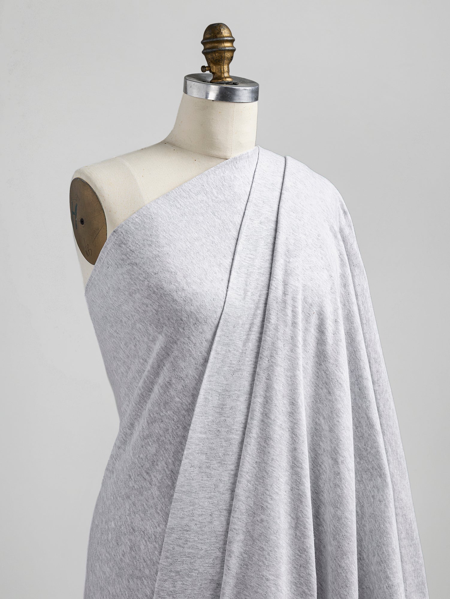 F-COT329-002-Pointelle-Jersey-Knit-Heather-Grey-Core-Fabrics-draped