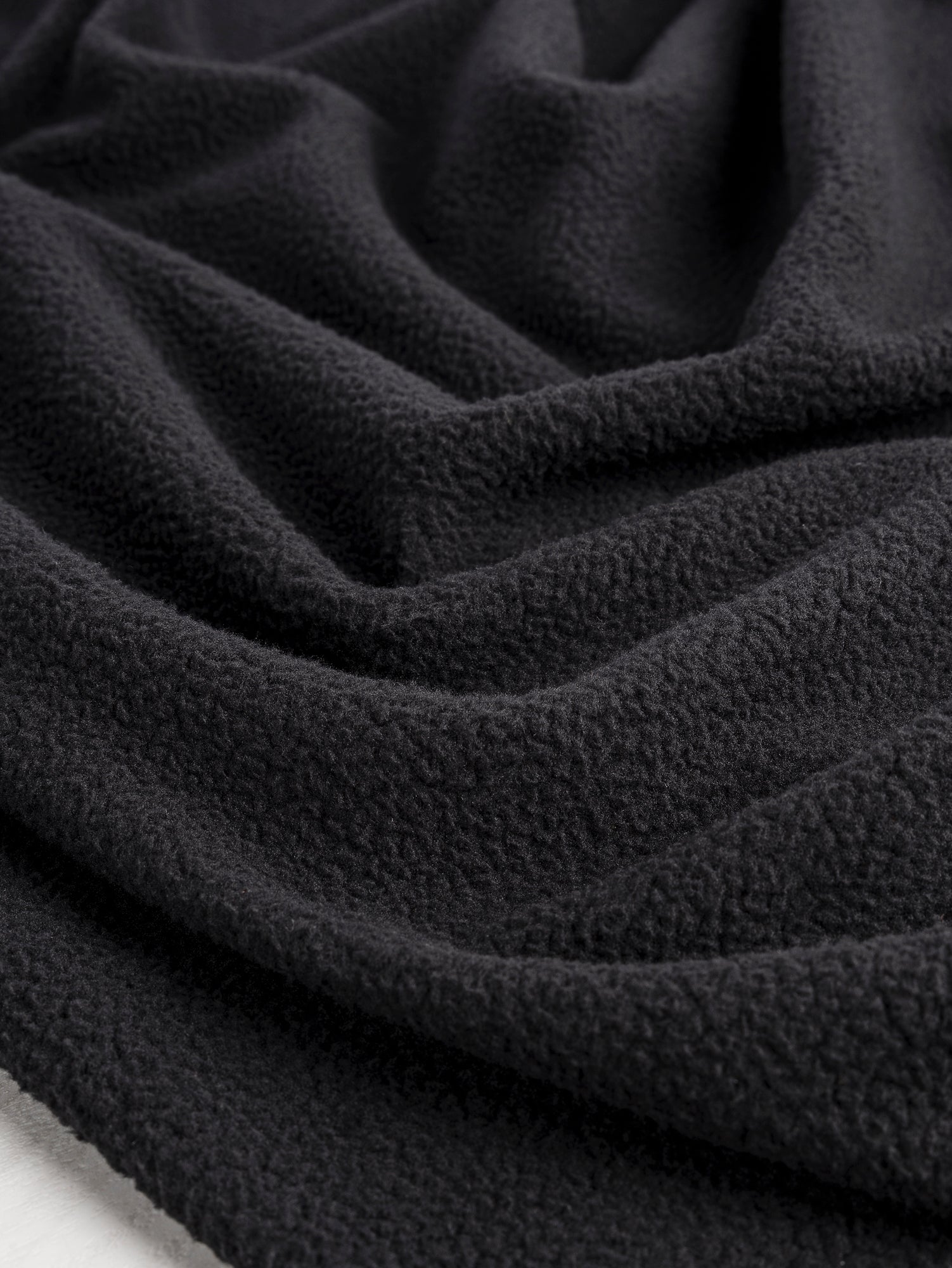 F-DEA084-Polartec-Thermal-Pro-Sherpa-Deadstock-Black-Core-Fabrics-scrunched.JPG