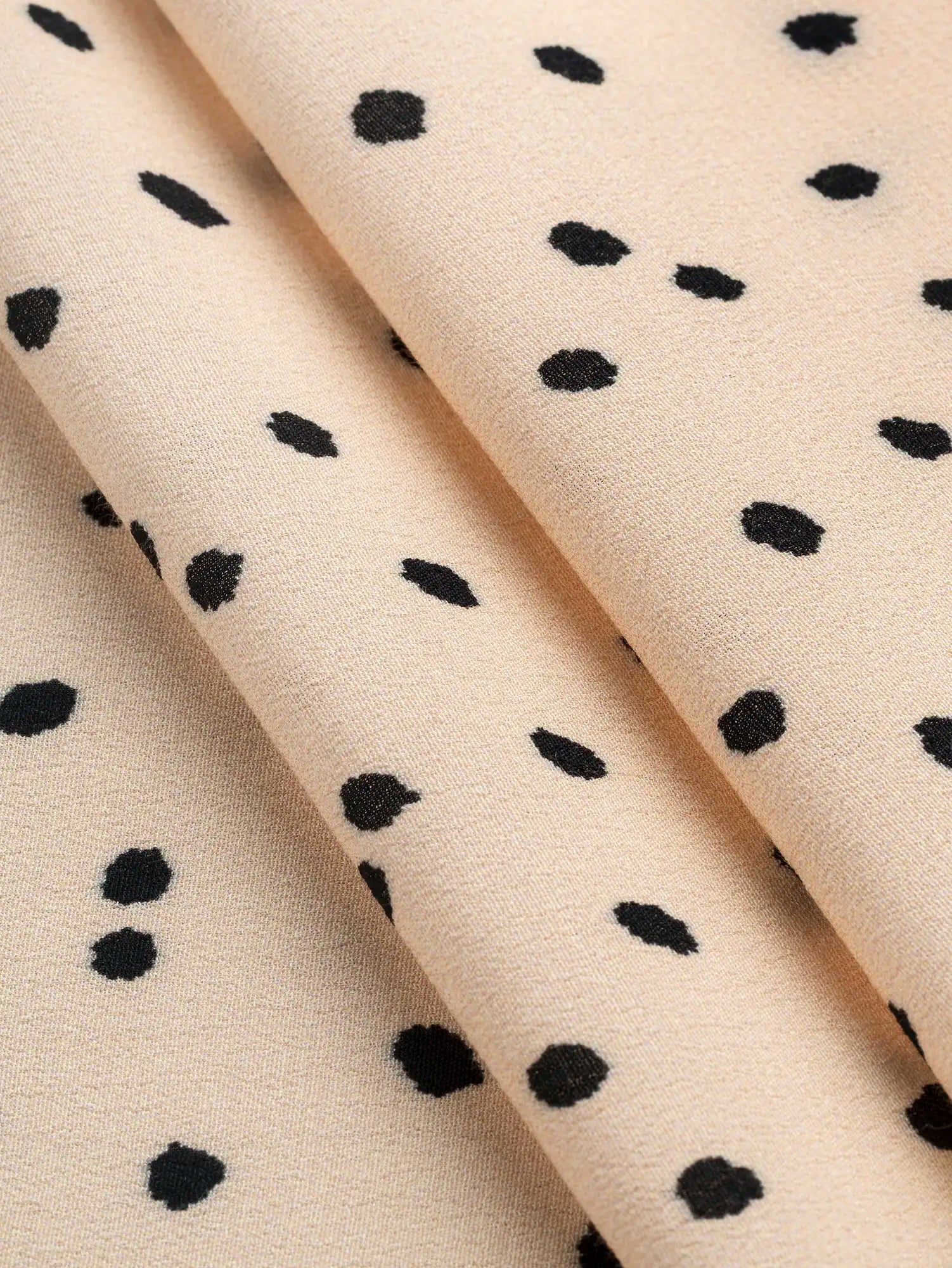 F-VIS295-Polka-Dot-Ecovero-Crepe-de-Chine-Oat-and-Black-Core-Fabrics-fold.webp