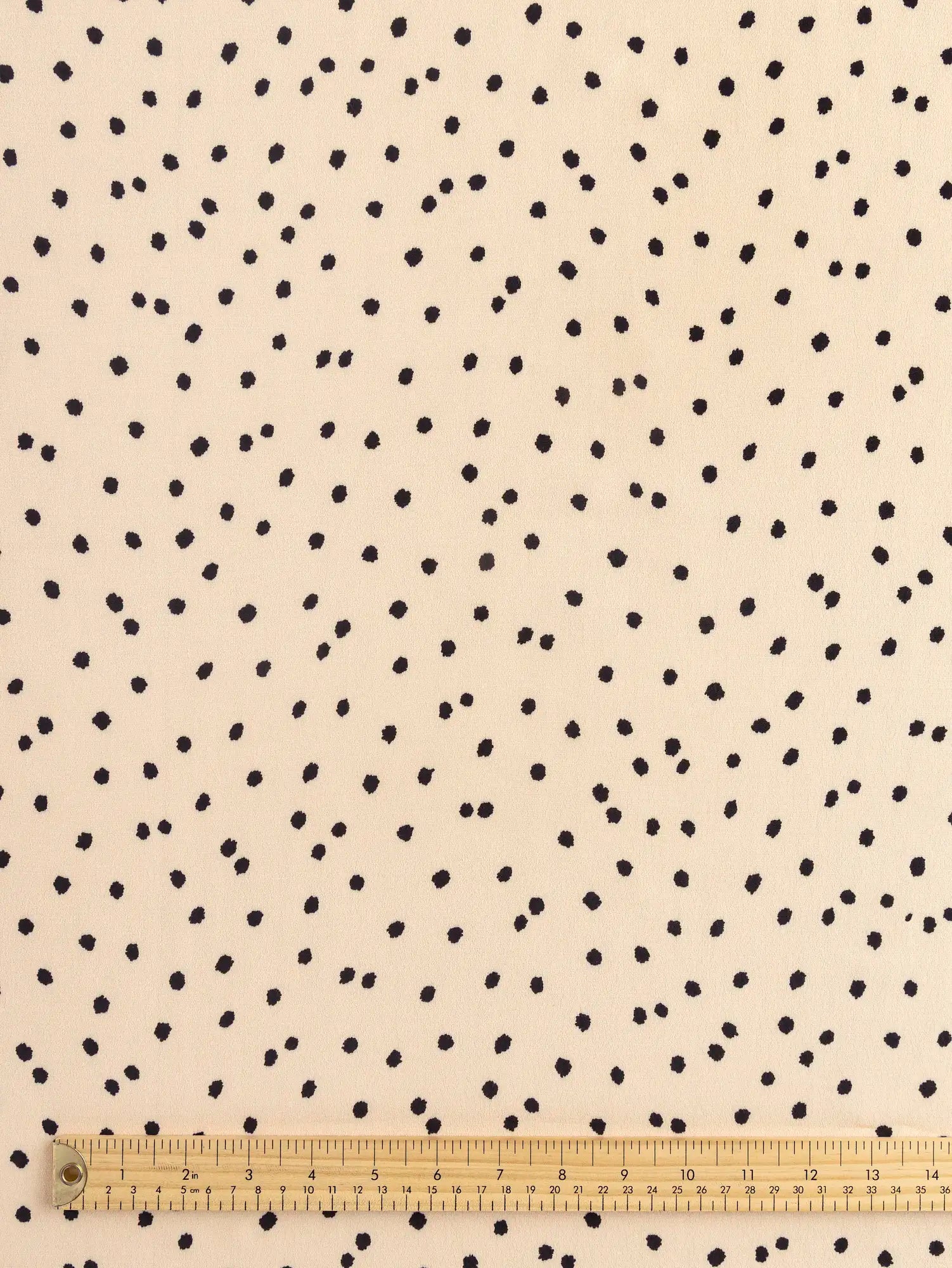 F-VIS295-Polka-Dot-Ecovero-Crepe-de-Chine-Oat-and-Black-Core-Fabrics-ruler.webp