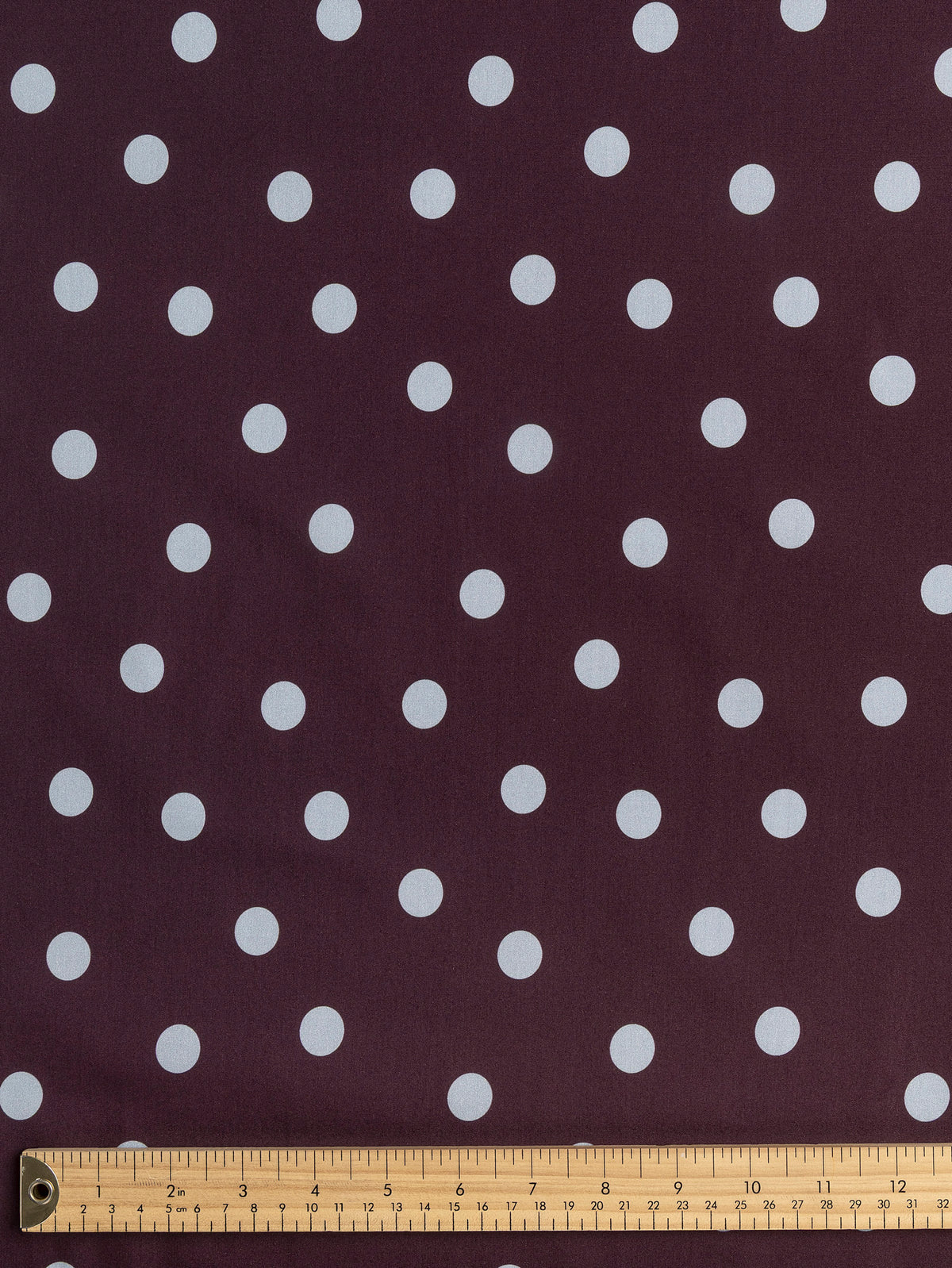 F-COT506-001-Polka-Dot-Print-Cotton-Poplin-Aubergine-and-Chambray-Core-Fabrics-ruler.webp