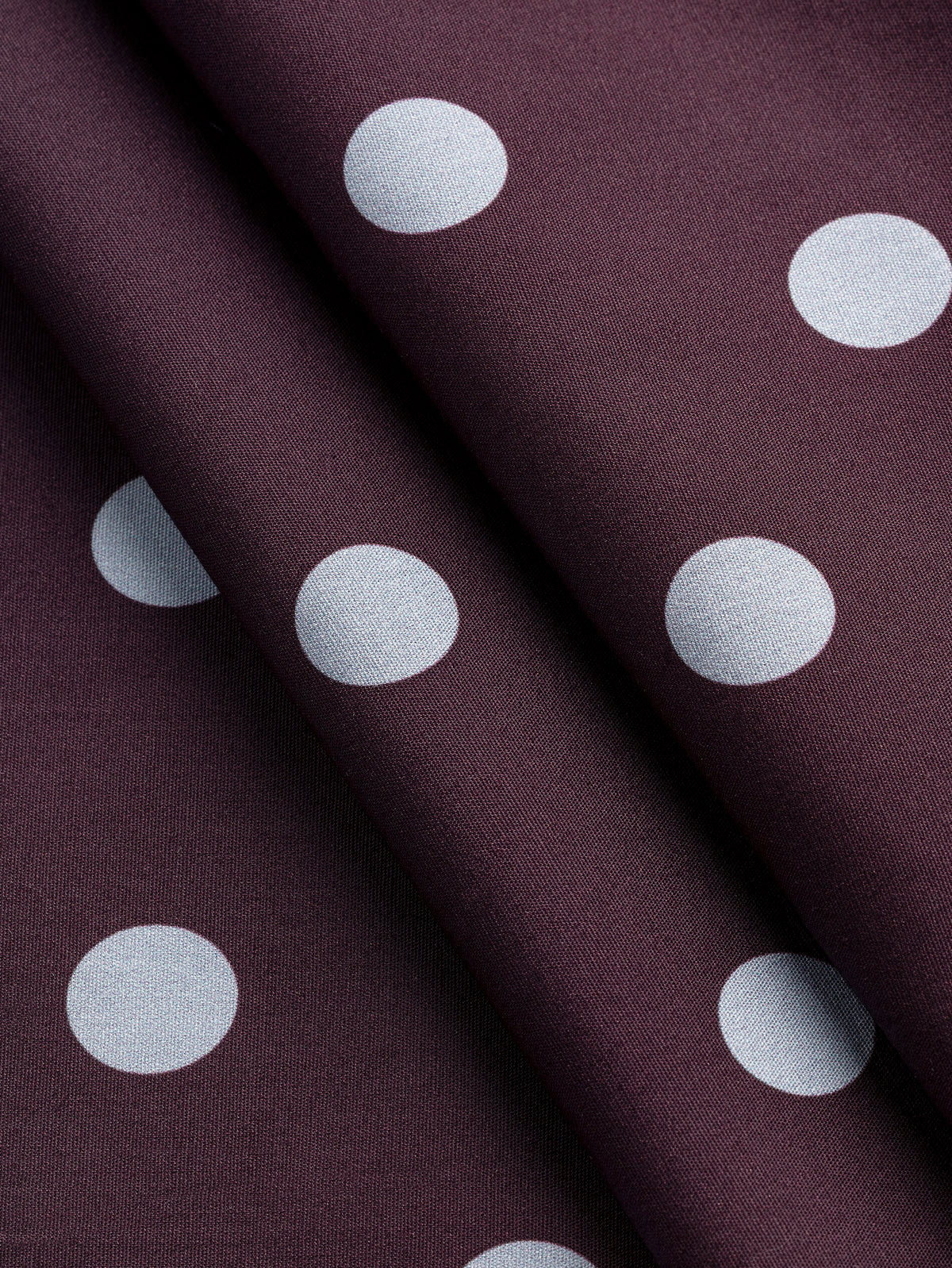 F-COT506-001-Polka-Dot-Print-Cotton-Poplin-Aubergine-and-Chambray-Core-Fabrics-fold.webp