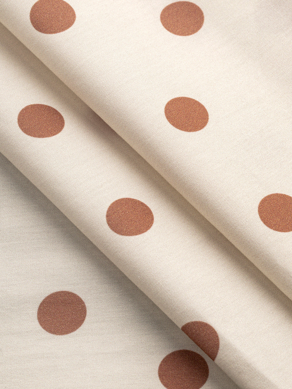F-COT506-002-Polka-Dot-Print-Cotton-Poplin-Ivory-and-Caramel-Core-Fabrics-fold.webp