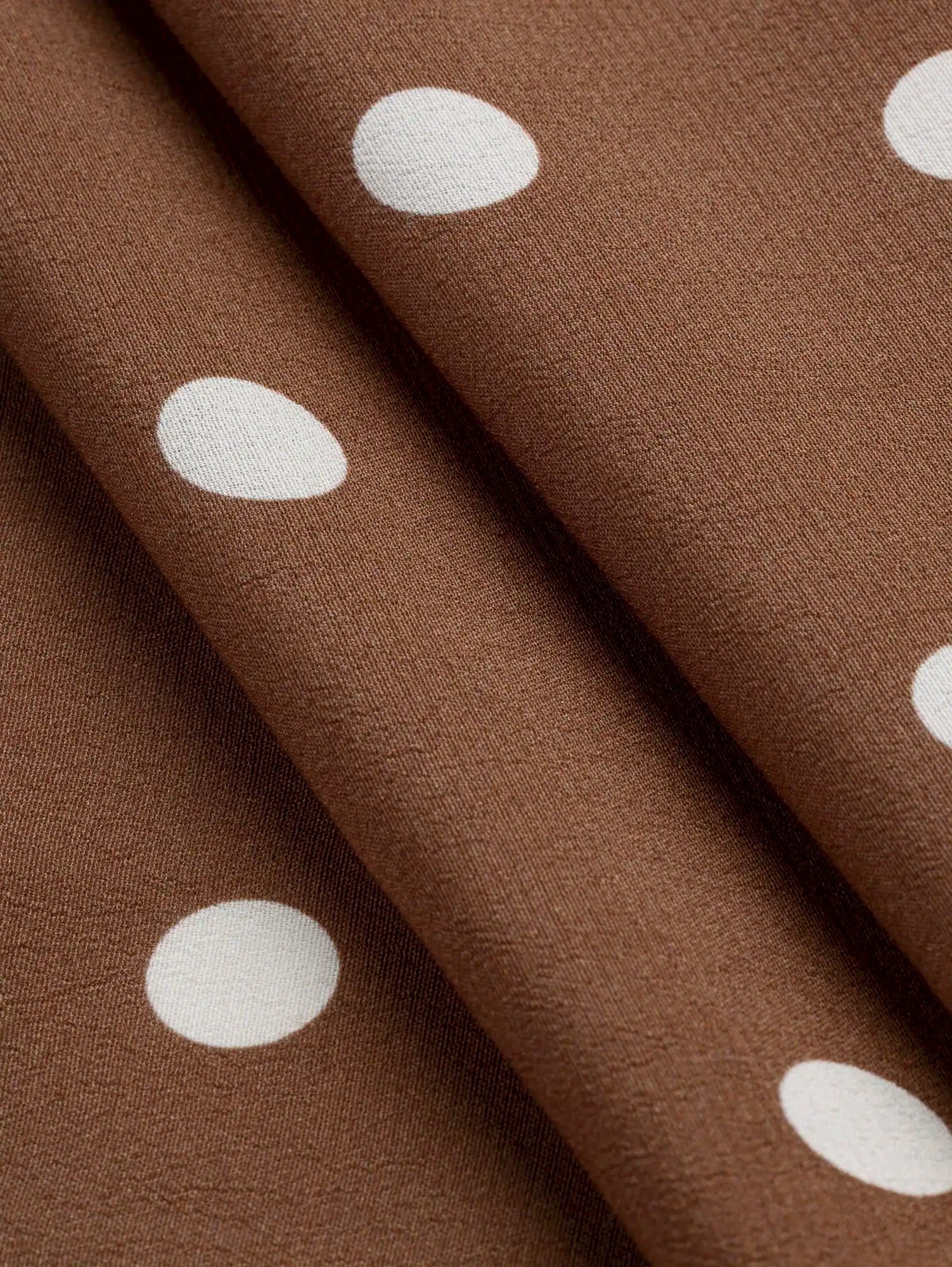 F-VIS294-Polka-Dot-Print-Ecovero-Crepe-de-Chine-Caramel-and-White-Core-Fabrics-fold.webp