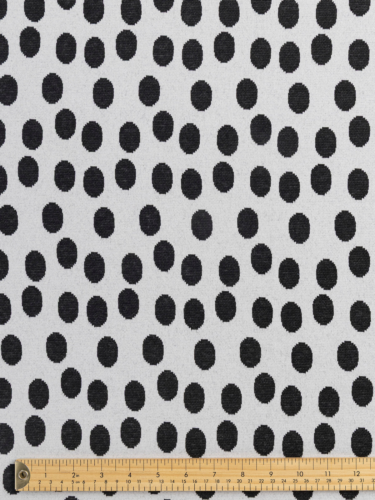 F-DEA255-Polka-Dot-Stretch-Knit-Deadstock-Pearl-and-Black-Core-Fabrics-ruler.webp
