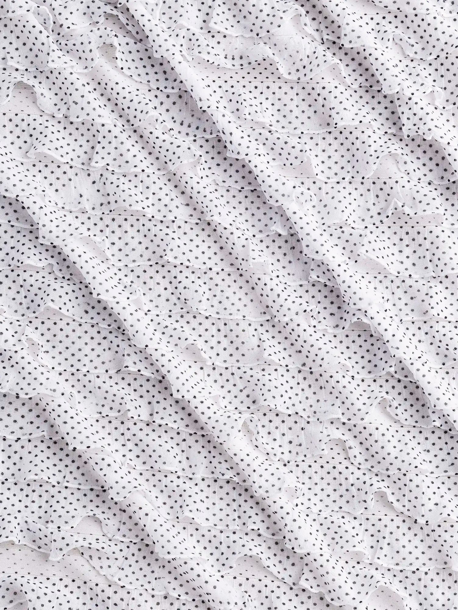 F-DEA184-Polka-Dot-Stretch-Ruffle-Mesh-White-and-Black-Core-Fabrics-scrunched.webp