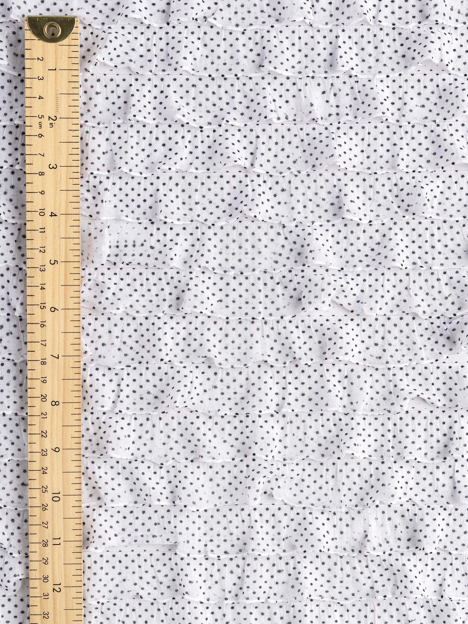 F-DEA184-Polka-Dot-Stretch-Ruffle-Mesh-White-and-Black-Core-Fabrics-ruler.webp