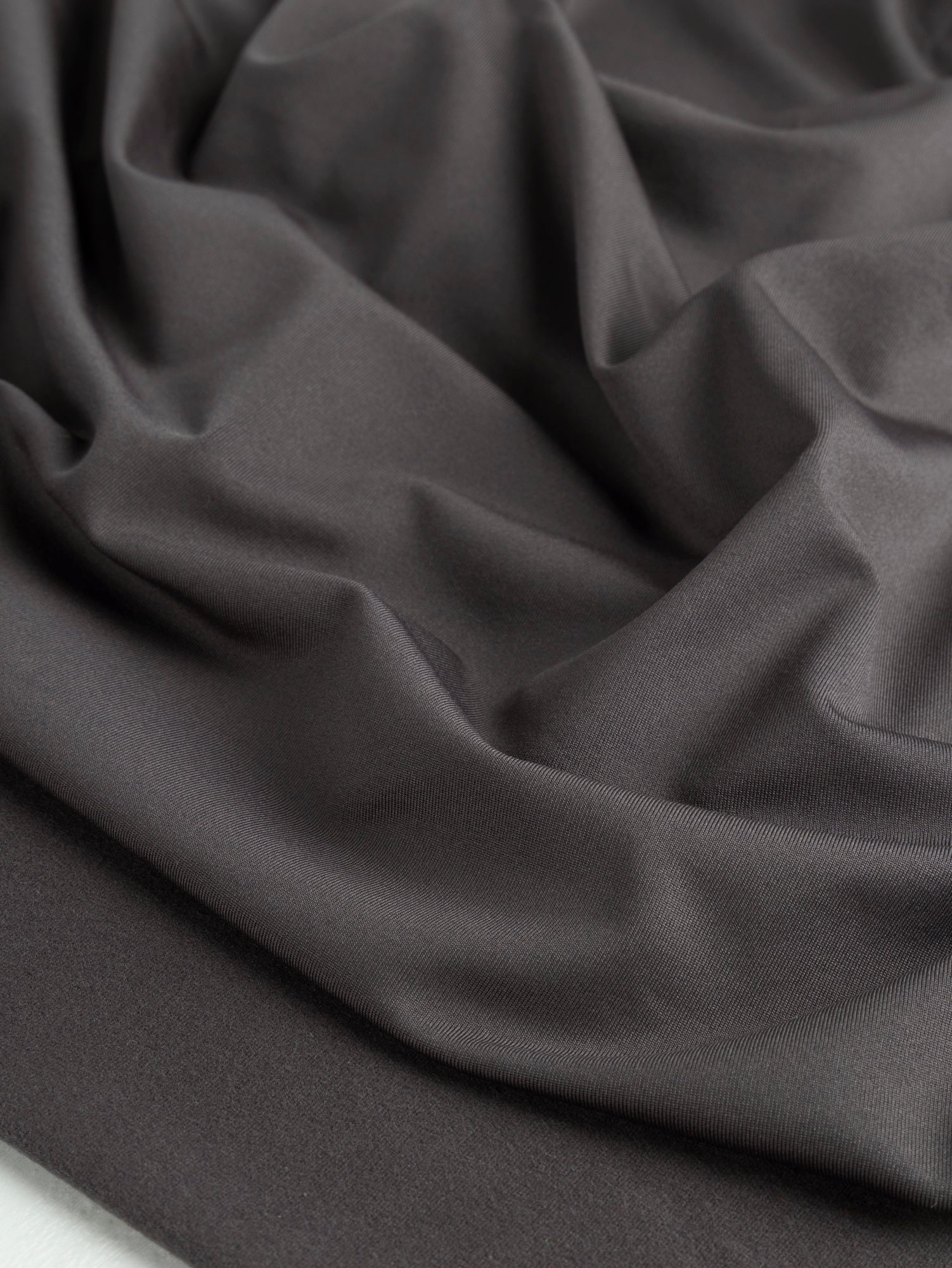 F-PES035-002-Poly-Brushed-Stretch-Jersey-Knit-Deadstock-Charcoal-Core-Fabrics-scrunched.JPG