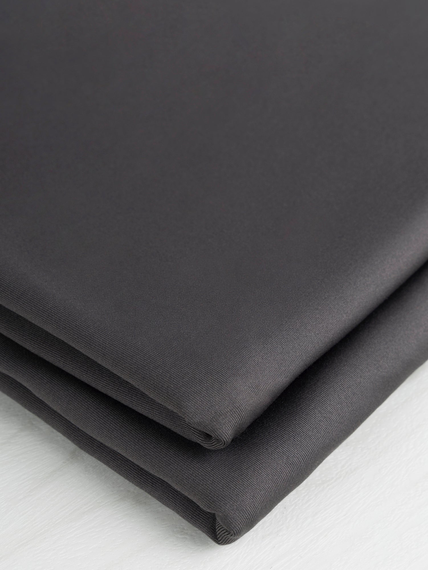 F-PES035-002-Poly-Brushed-Stretch-Jersey-Knit-Deadstock-Charcoal-Core-Fabrics-fold.JPG
