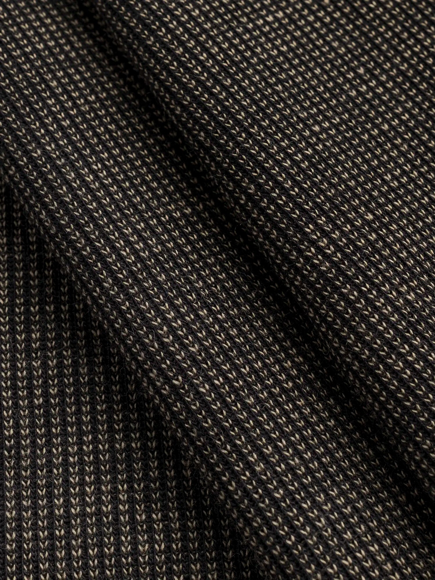 F-DEA188-Poly-Cotton-Blend-Knit-Deadstock-Black-and-Sand-Core-Fabrics-fold.webp
