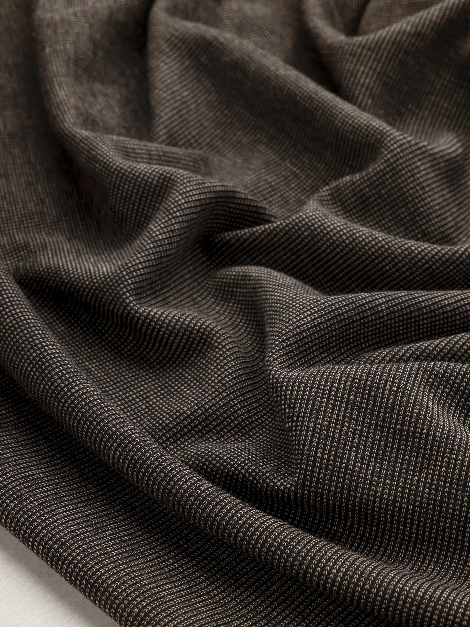 F-DEA188-Poly-Cotton-Blend-Knit-Deadstock-Black-and-Sand-Core-Fabrics-scrunched.webp