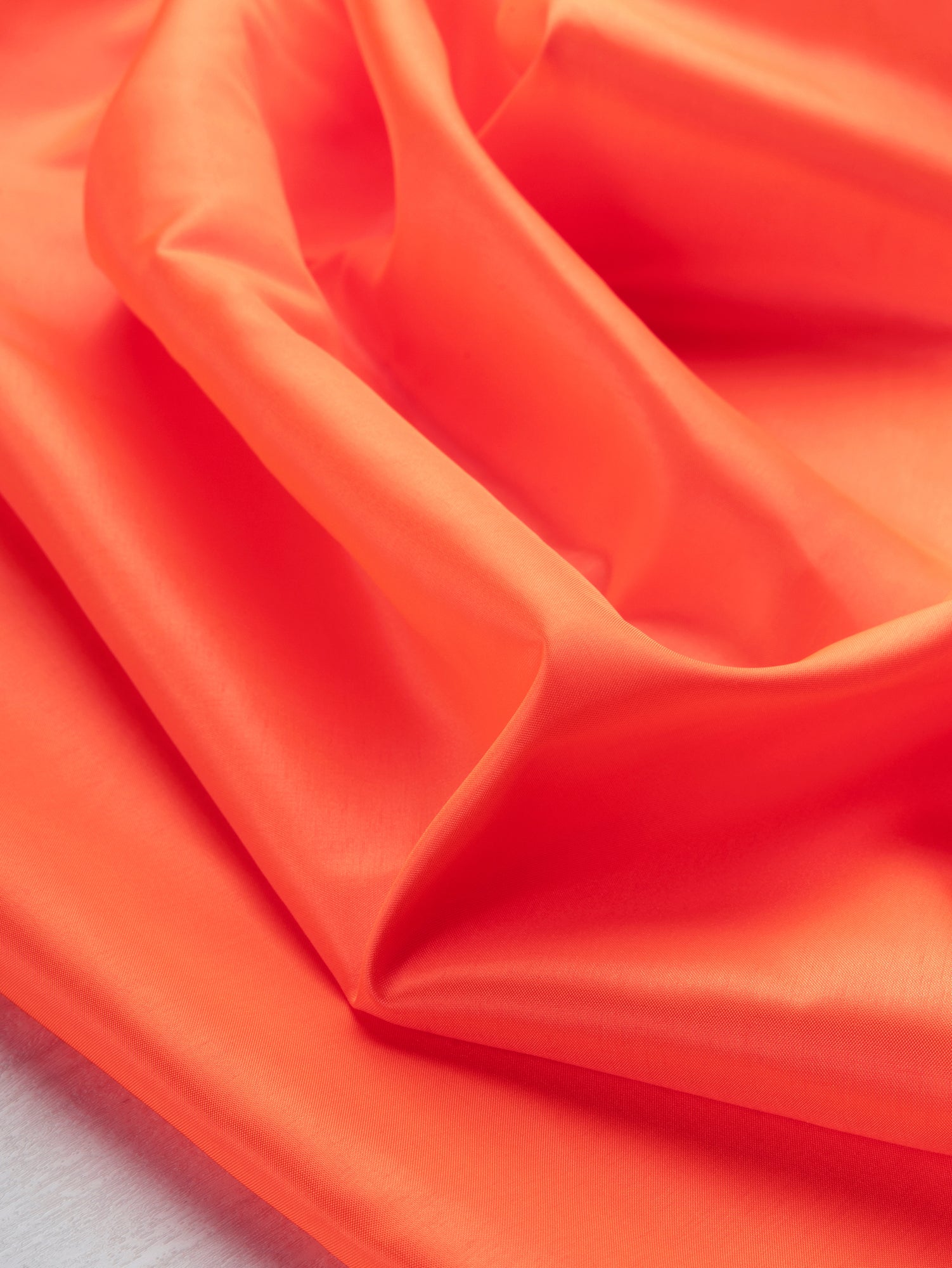 F-DEA099-Polyester-Lining-Deadstock-Bright-Orange-Core-Fabrics-scrunched.JPG