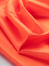 F-DEA099-Polyester-Lining-Deadstock-Bright-Orange-Core-Fabrics-scrunched.JPG
