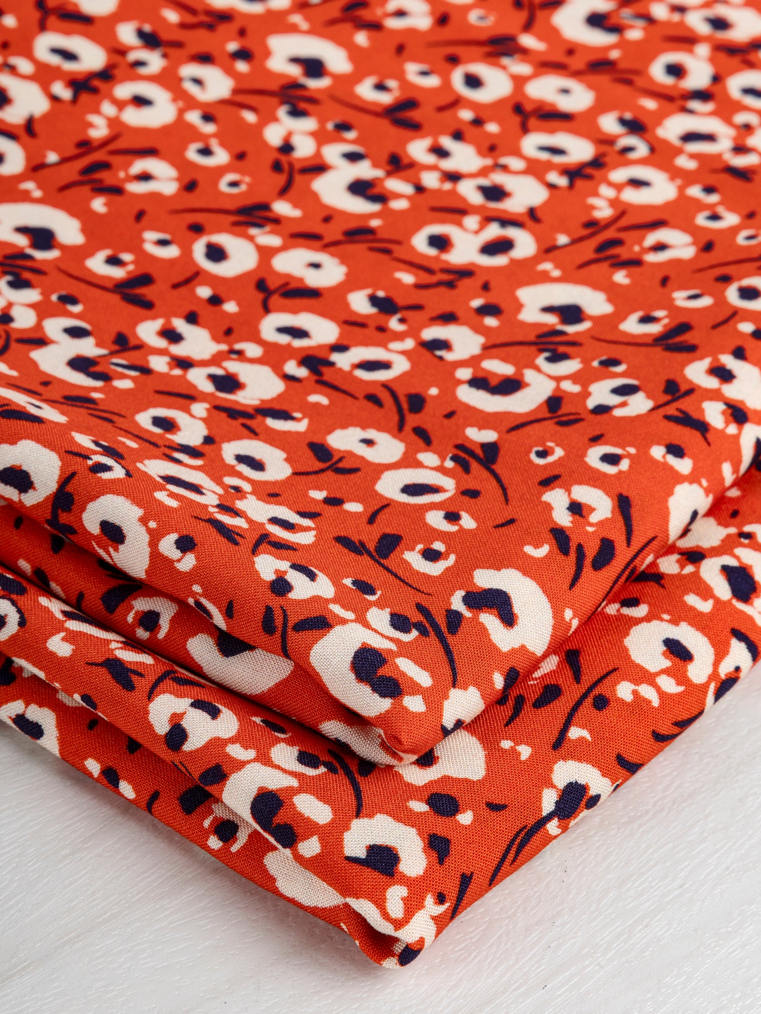 F-VIS241-Poppy-Small-Floral-Print-Ecovero-Viscose-Red-Cream-Navy-Core-Fabrics-fold.JPG