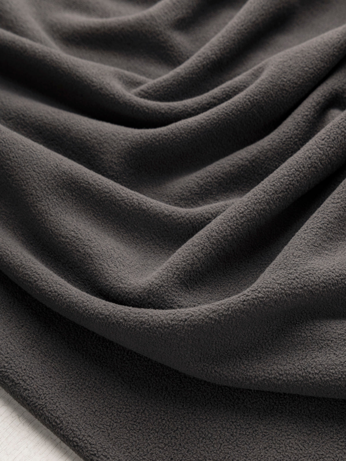 F-DEA253-003-RPET-Polar-Fleece-Deadstock-Charcoal-Core-Fabrics-scrunched.webp
