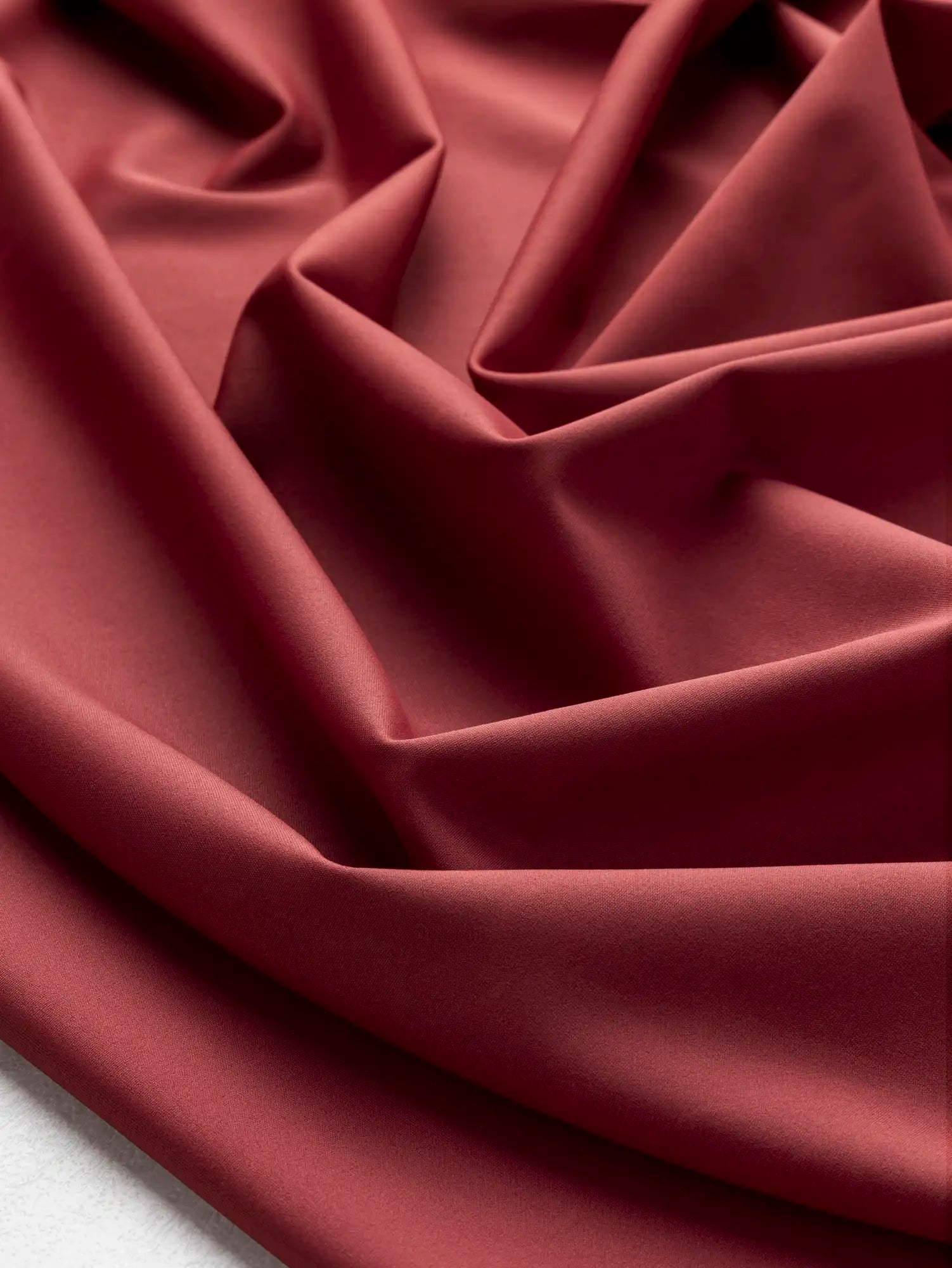 F-NYL027-006-Recycled-Nylon-Spandex-Performance-and-Swim Knit-Garnet-Core-Fabrics-scrunched.webp