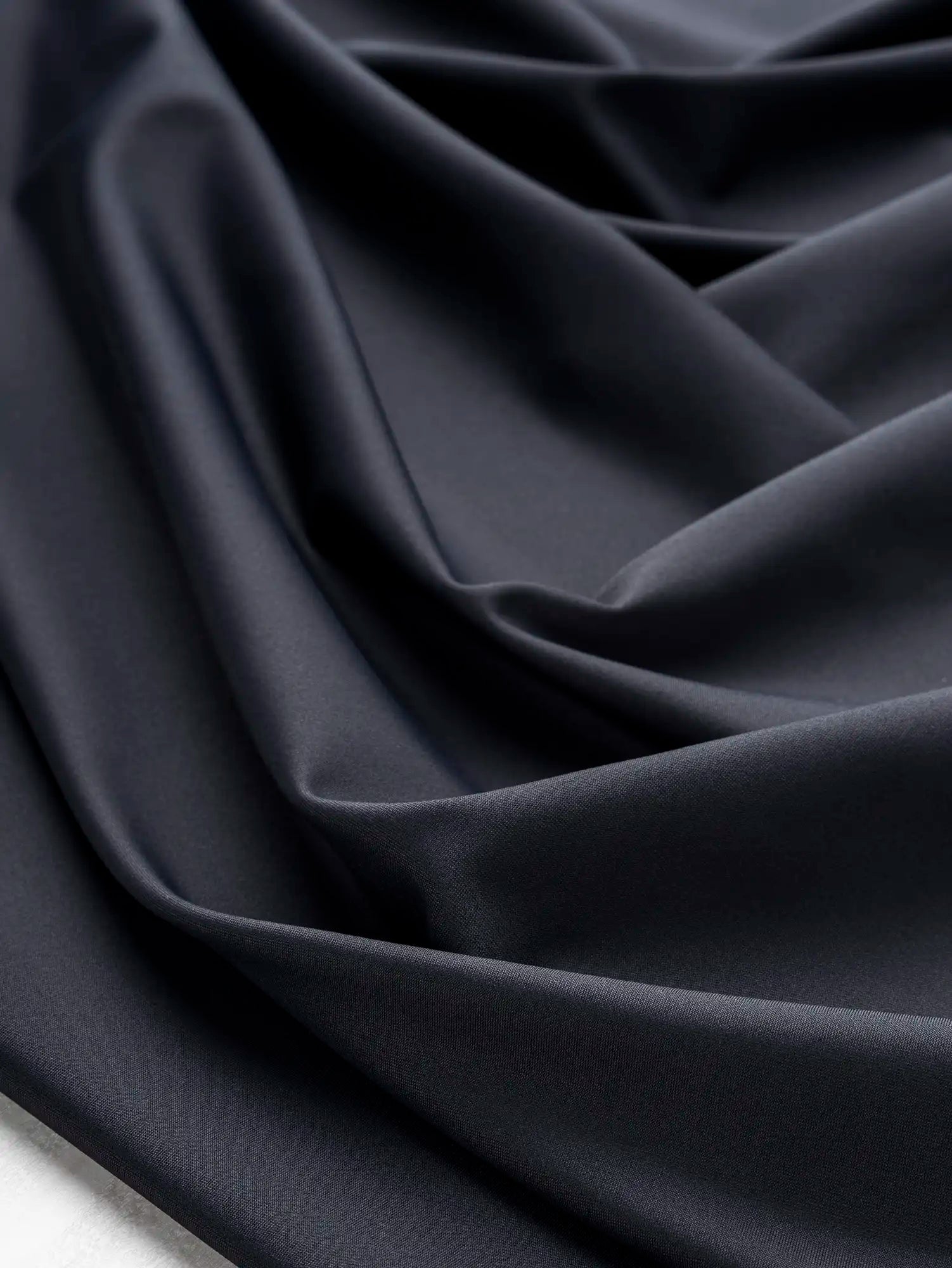 F-NYL027-001-Recycled-Nylon-Spandex-Performance-and-Swim Knit-Onyx-Core-Fabrics-scrunched.webp