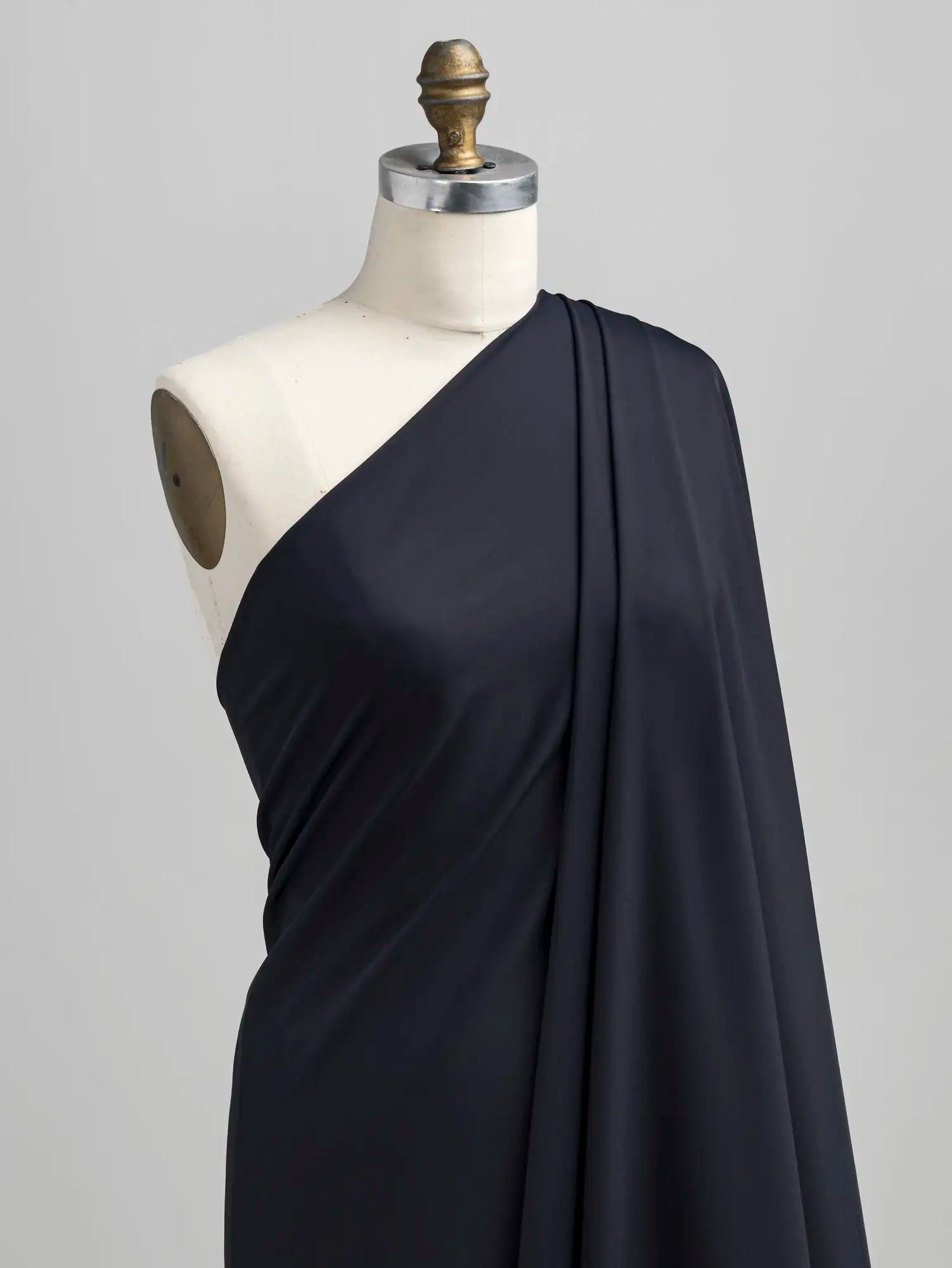 F-NYL027-001-Recycled-Nylon-Spandex-Performance-and-Swim Knit-Onyx-Core-Fabrics-draped.webp