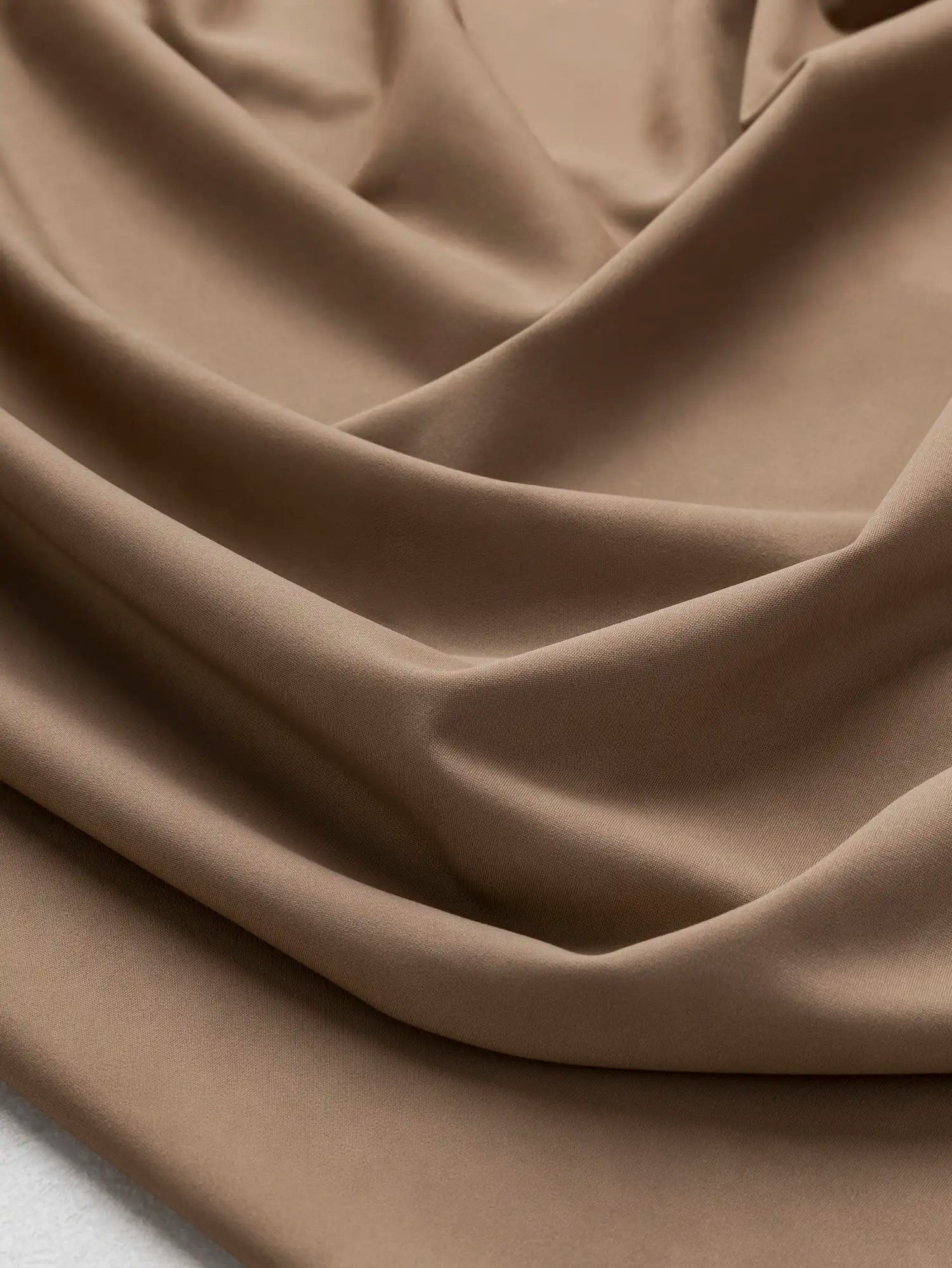 F-NYL027-007-Recycled-Nylon-Spandex-Performance-and-Swim-Knit-Sand-Core-Fabrics-scrunched.webp