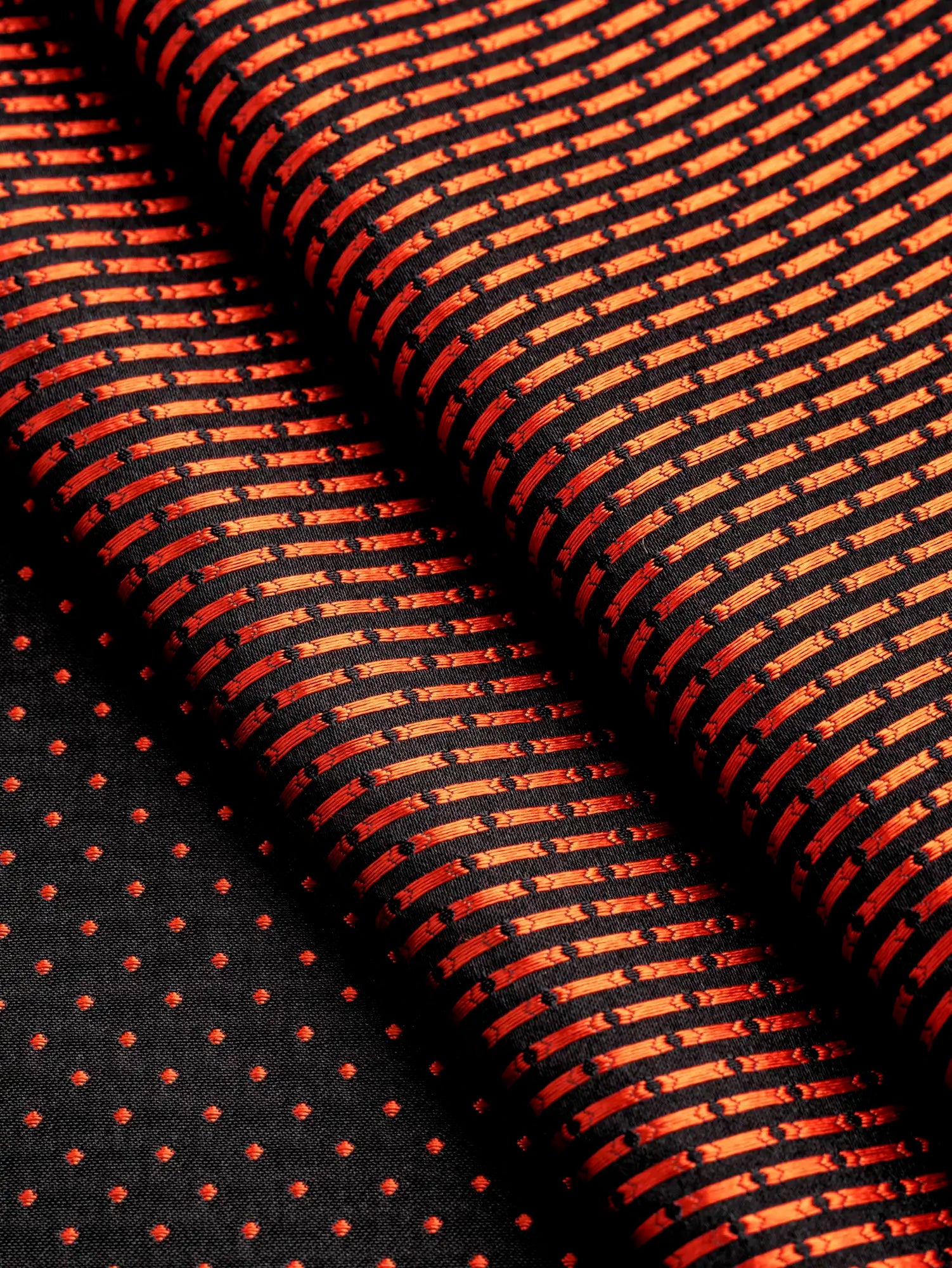 F-DEA190-Reversible-Silk-Jacquard-Deadstock-Black-and-Orange-Core-Fabrics-fold.webp