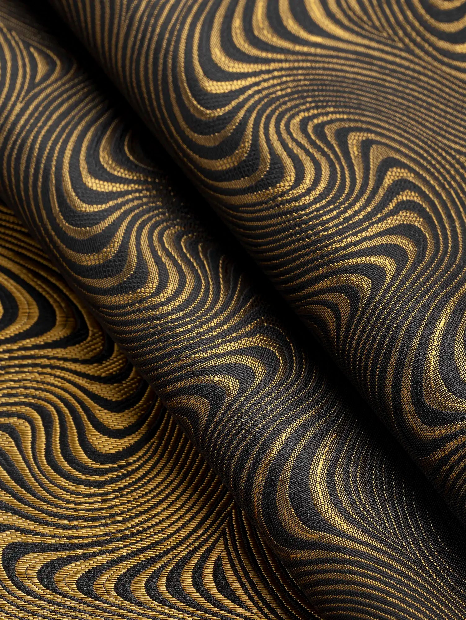 F-DEA194-Reversible-Swirly-Jacquard-Deadstock-Black-and-Gold-Core-Fabrics-fold.webp