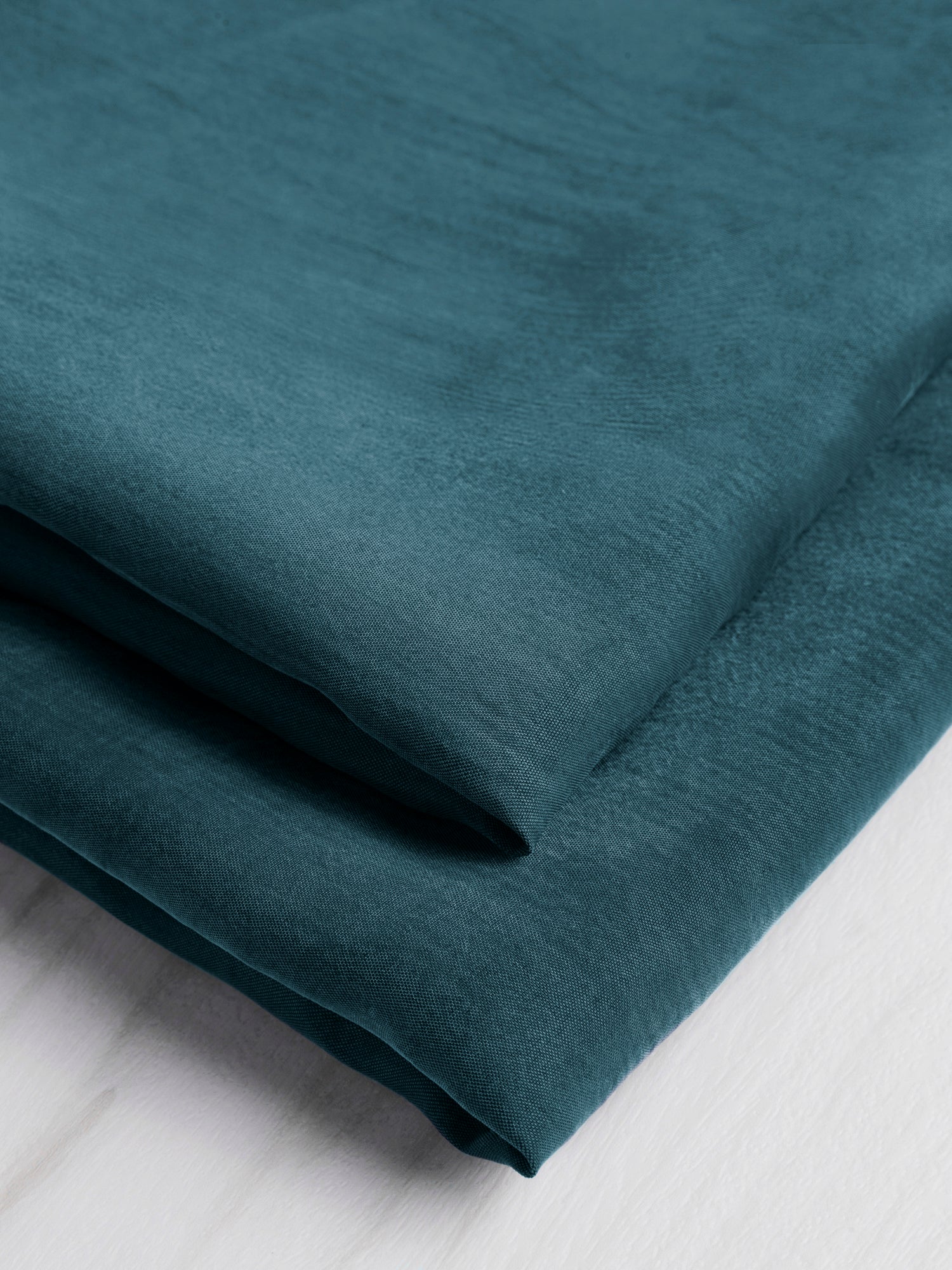 F-CUP001-019-Sandwashed-Cupro-Deep-Teal-Core-Fabrics-fold.JPG