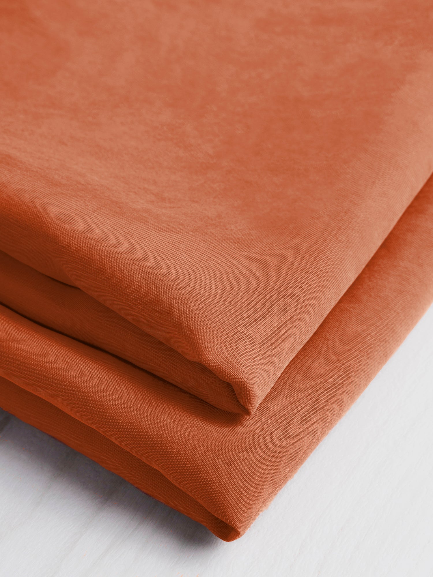 F-CUP001-018-Sandwashed-Cupro-Terracotta-Core-Fabrics-fold.JPG