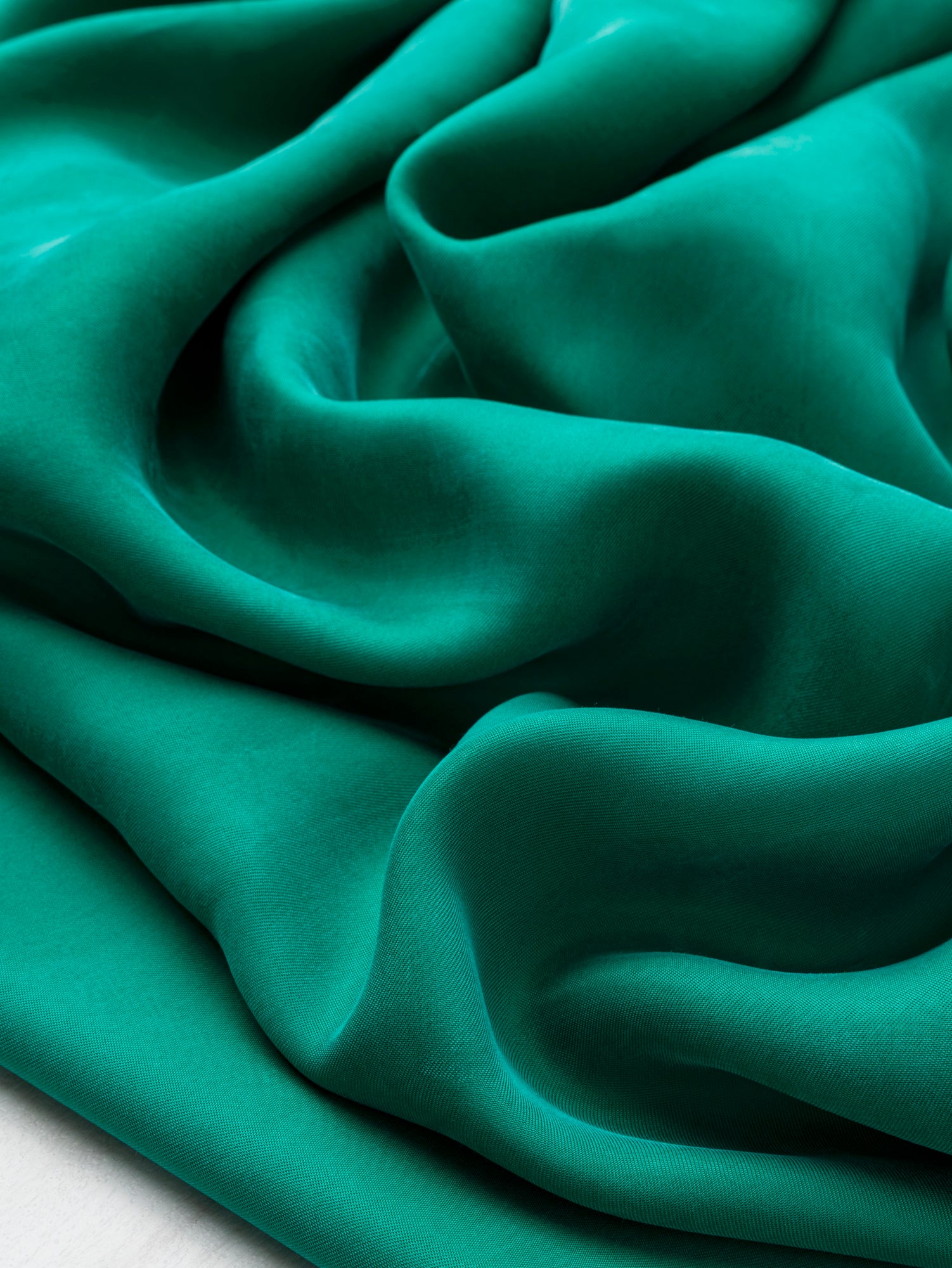 F-DEA122-Sandwashed-Cupro-Deadstock-Emerald-Green-Core-Fabrics-scrunched.JPG
