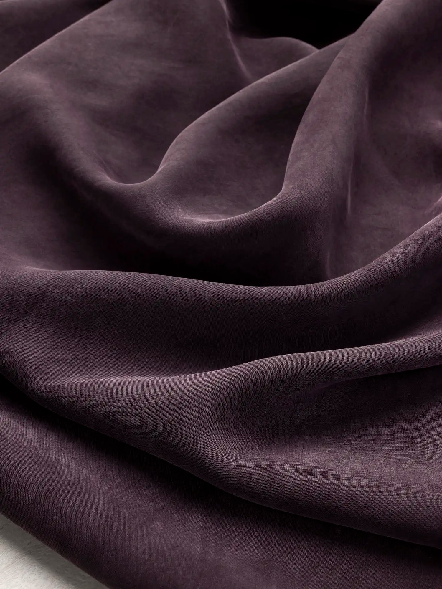 F-TEN018-004-Sandwashed-Tencel-Lyocell-Viscose-Aubergine-Core-Fabrics-scrunched.webp