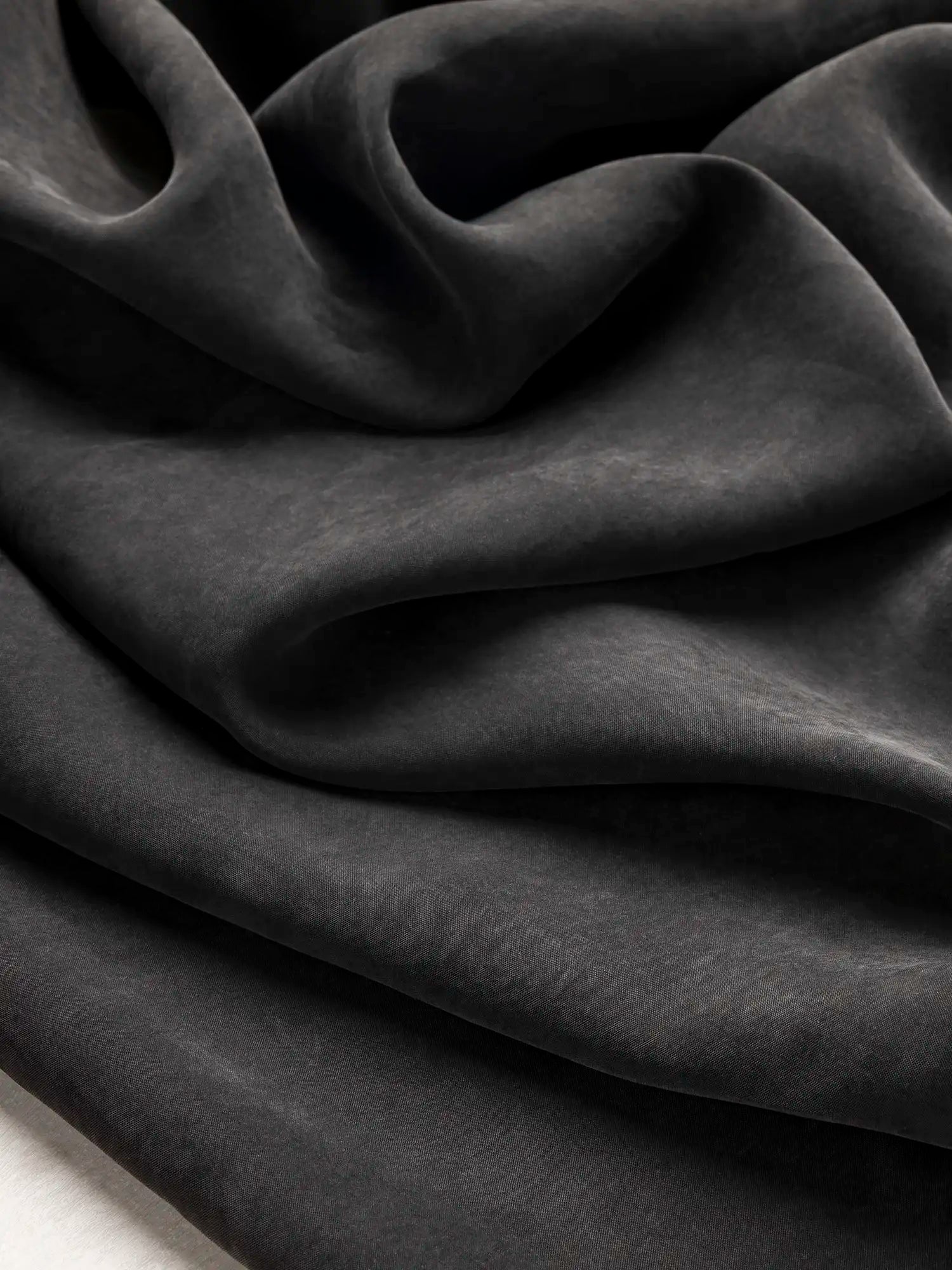 F-TEN018-001-Sandwashed-Tencel-Lyocell-Viscose-Black-Core-Fabrics-scrunched.webp