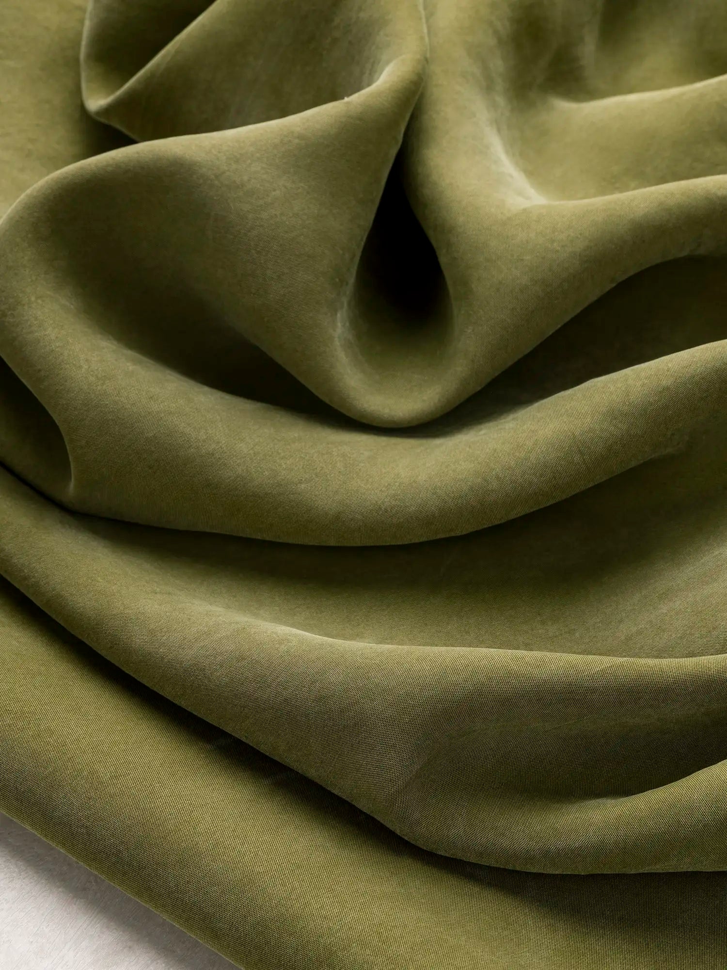 F-TEN018-005-Sandwashed-Tencel-Lyocell-Viscose-Olive-Core-Fabrics-scrunched.webp