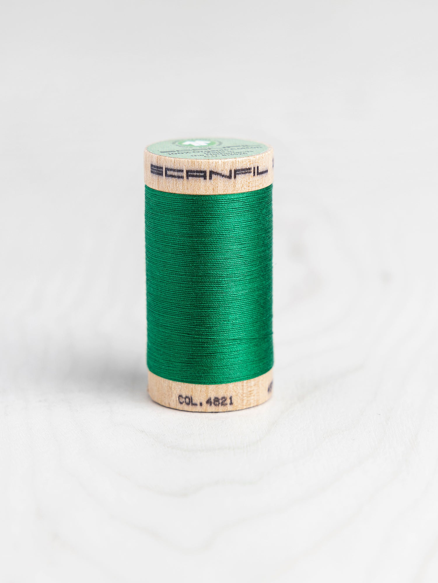 T-COT002-4821-Scanfil-Organic-Cotton-50wt-Thread-500-yard-Jolly-Green-4821-Core-Fabric