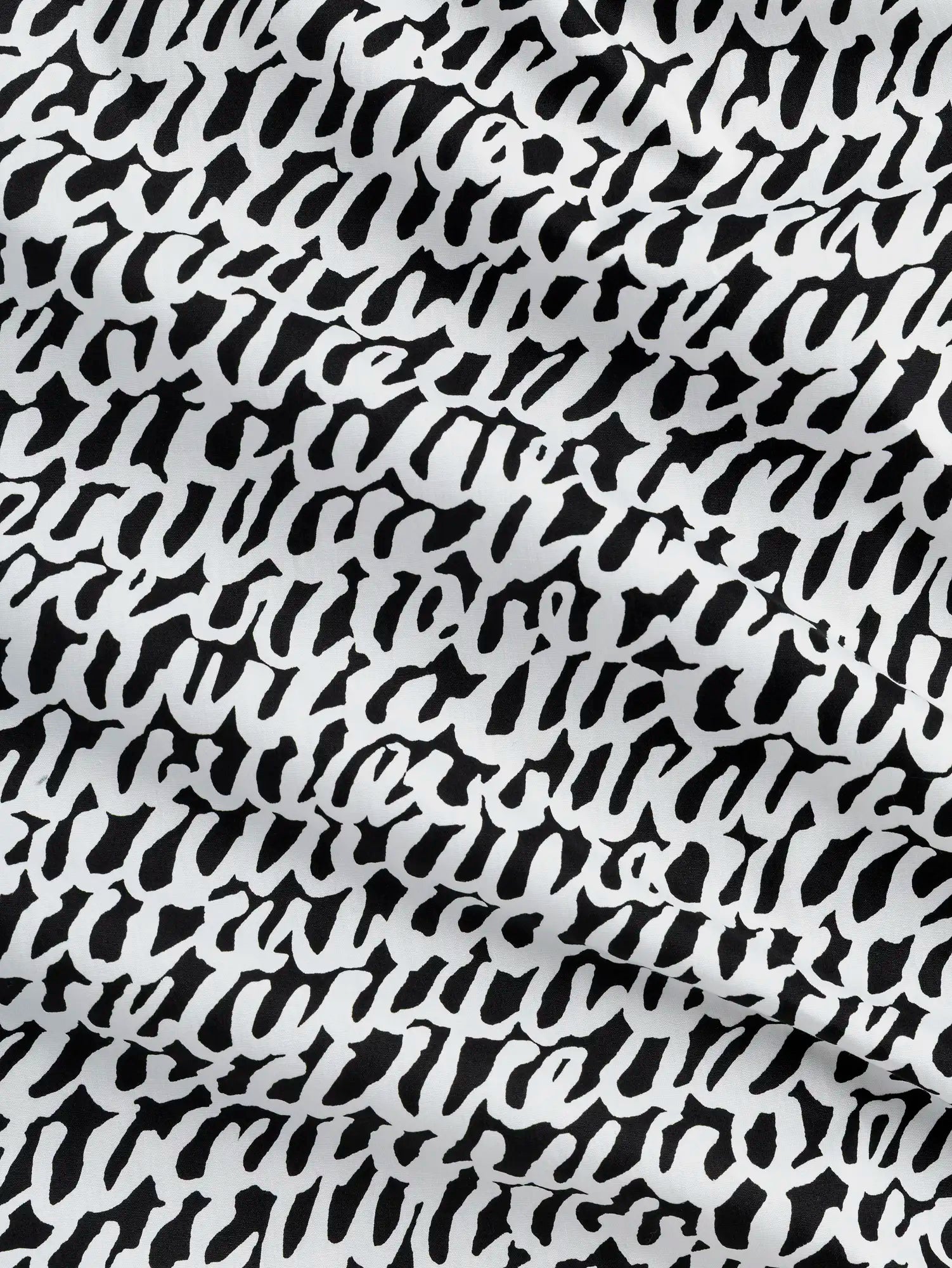 F-COT400-003-Scribble-Print-Japanese-Cotton-Lawn-Black-and-White-Core-Fabrics-scrunched.webp