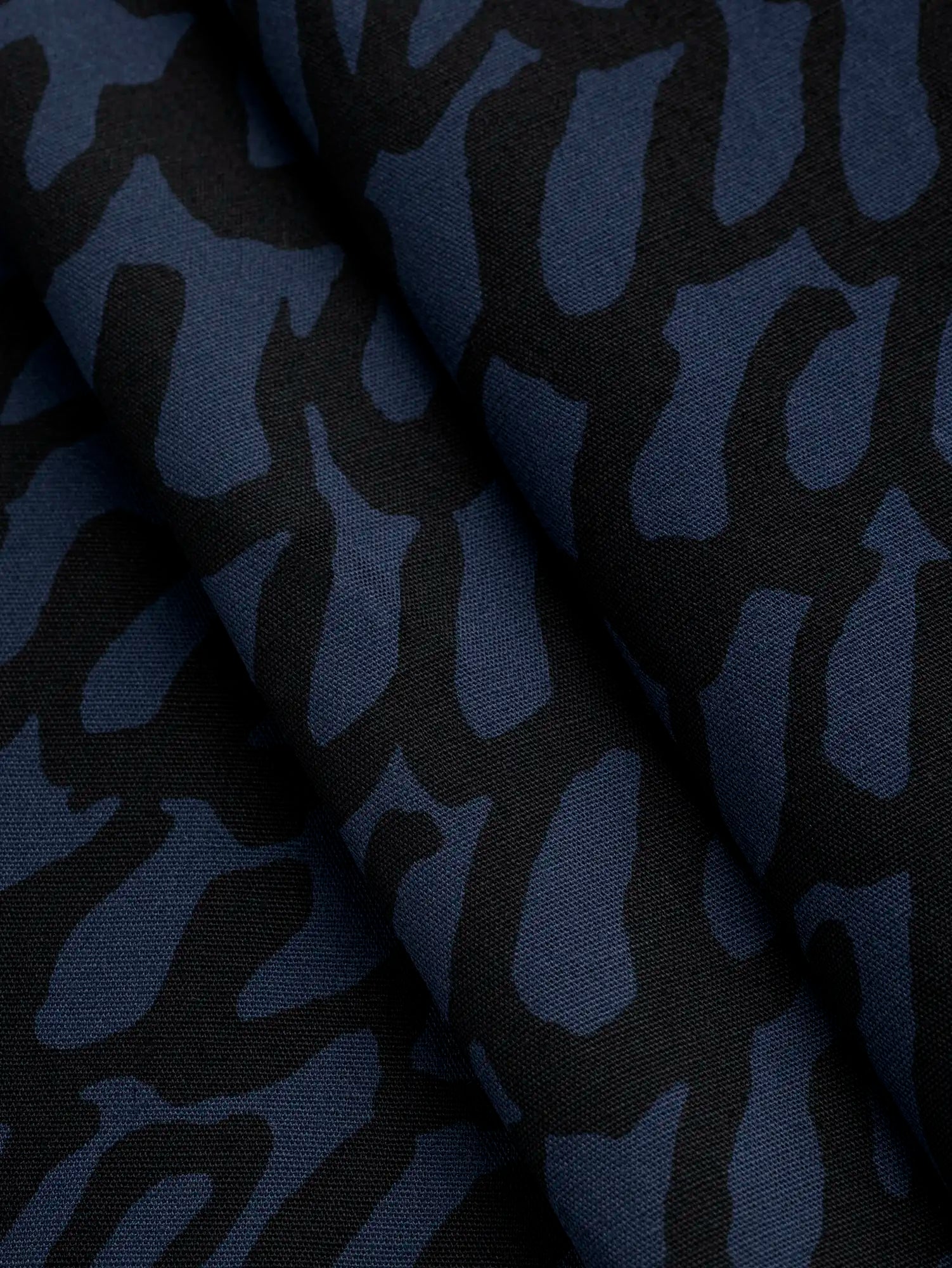 F-COT400-001-Scribble-Print-Japanese-Cotton-Lawn-Indigo-and-Black-Core-Fabrics-fold.webp