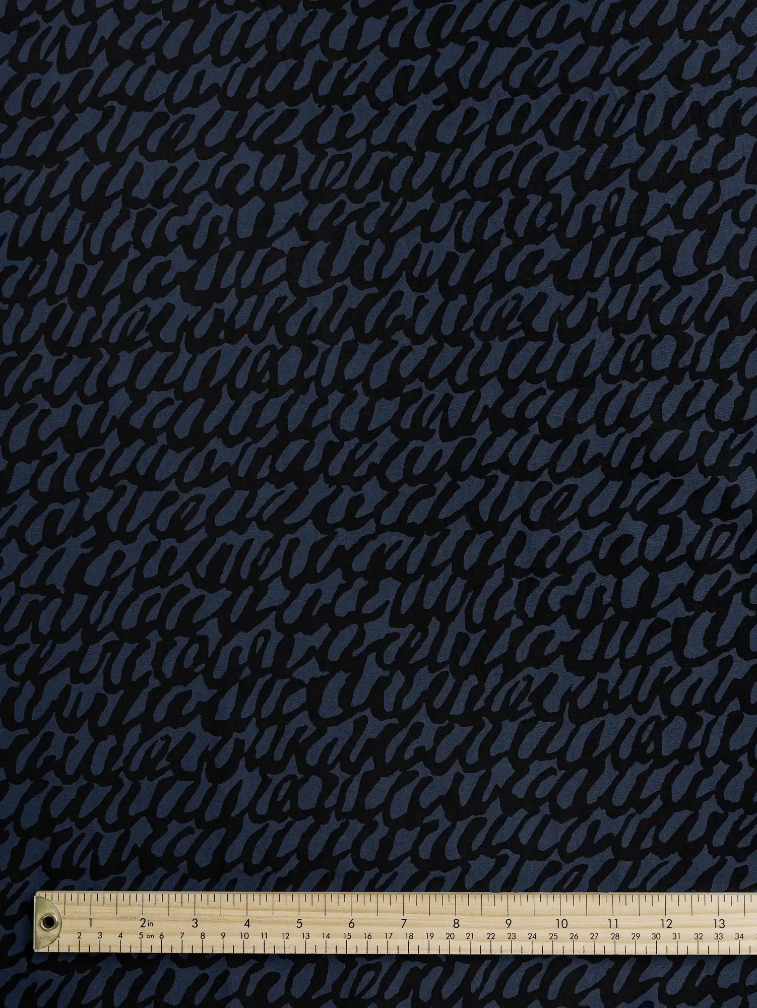 F-COT400-001-Scribble-Print-Japanese-Cotton-Lawn-Indigo-and-Black-Core-Fabrics-ruler.webp