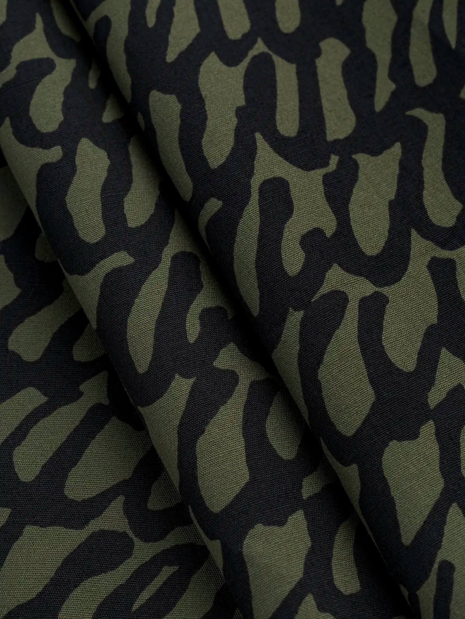 F-COT400-002-Scribble-Print-Japanese-Cotton-Lawn-Olive-and-Black-Core-Fabrics-fold.webp