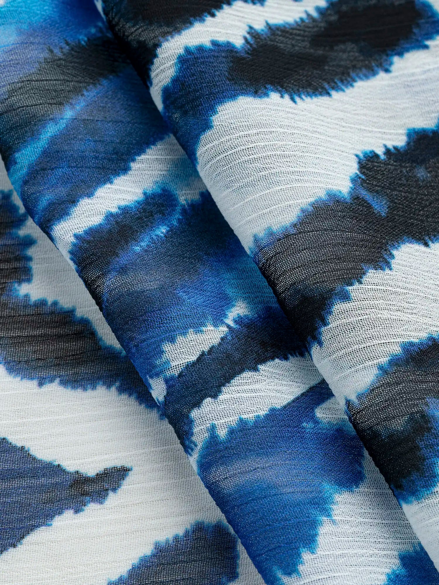 F-DEA173-Semi-Sheer-Abstract-Panel-Print-Chiffon-Deadstock-Blue-Black-and-Off-White-Core-Fabrics-fold.webp