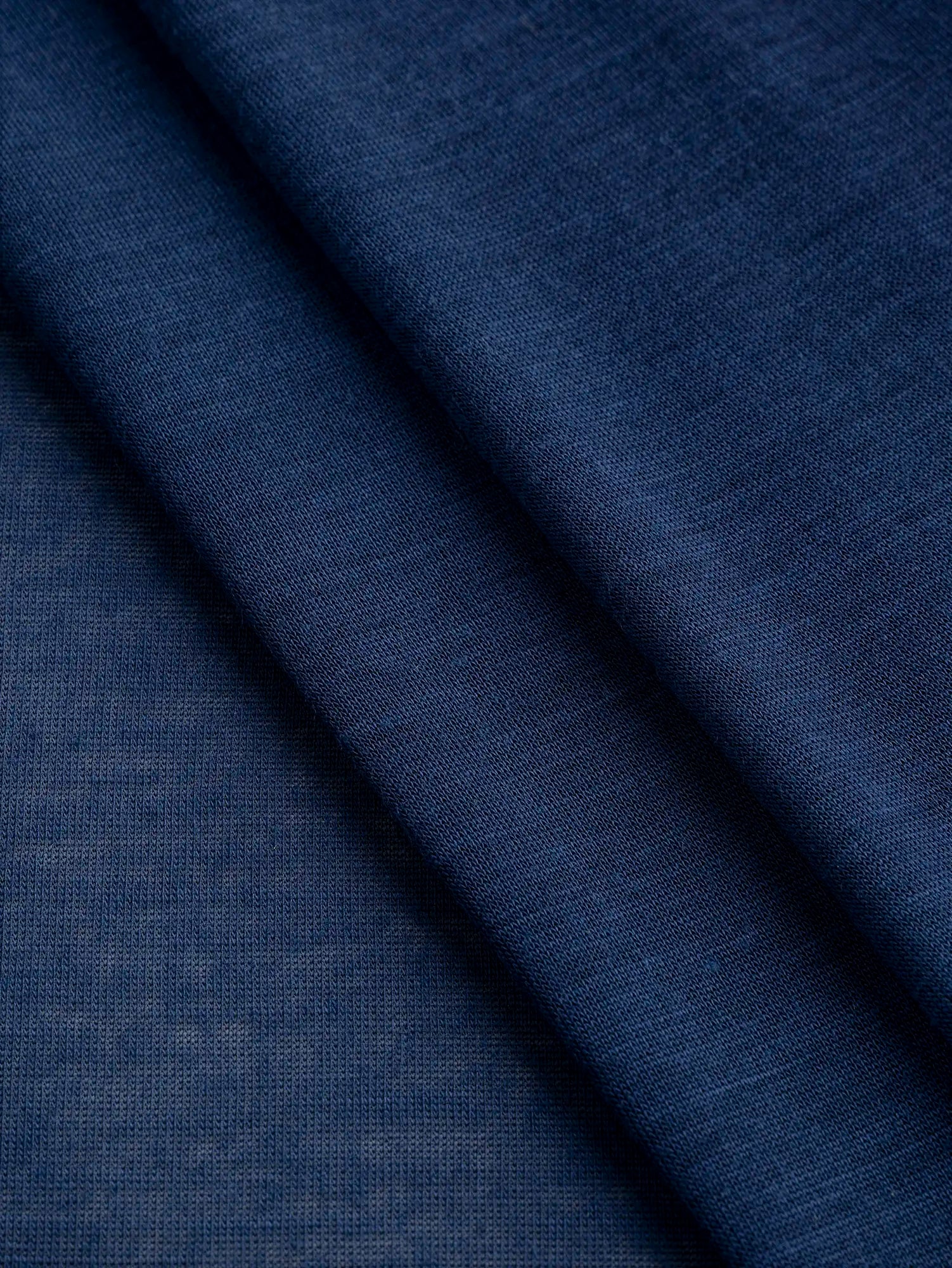 F-DEA203-003-Semi-Sheer-Viscose-Stretch-Knit-Deadstock-Midnight-Blue-Core-Fabrics-fold.webp