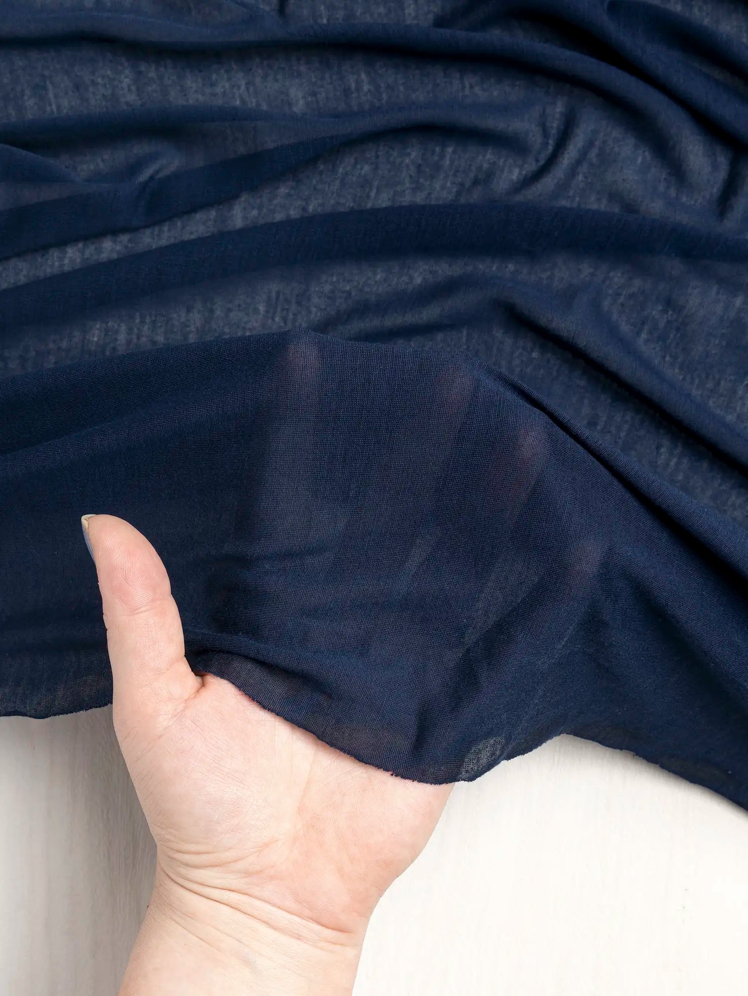 F-DEA203-003-Semi-Sheer-Viscose-Stretch-Knit-Deadstock-Midnight-Blue-Core-Fabrics-transparency.webp