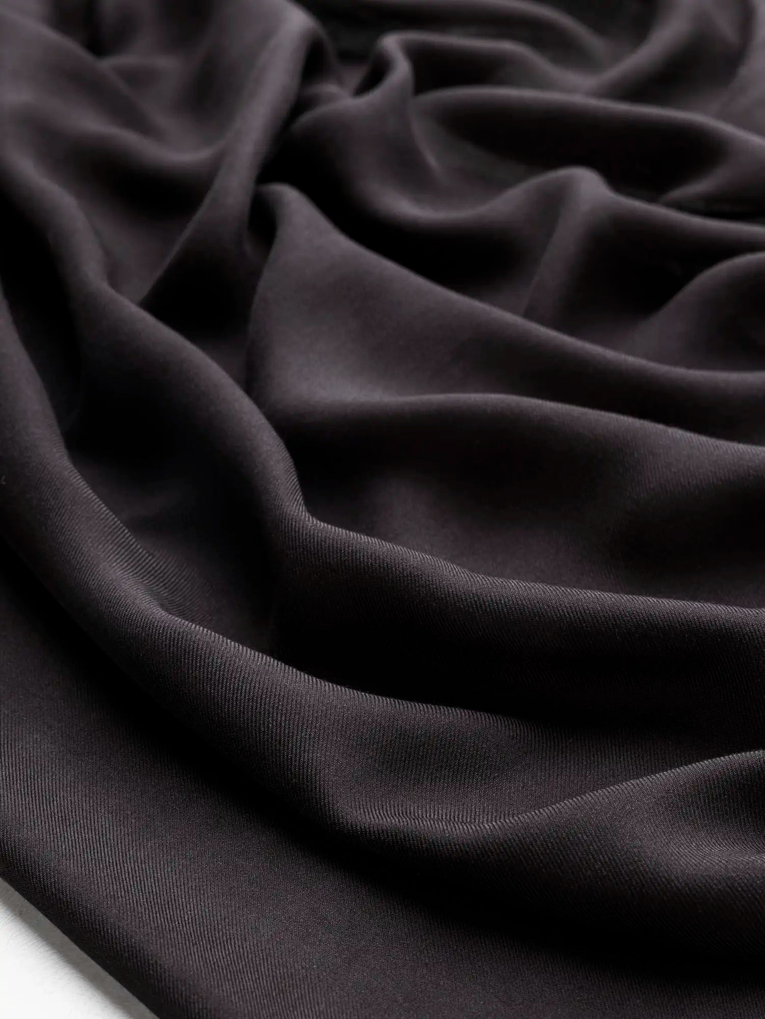 F-DEA230-Semi-Sheer-Viscose-Twill-Deadstock-Black-Core-Fabrics-scrunched.webp
