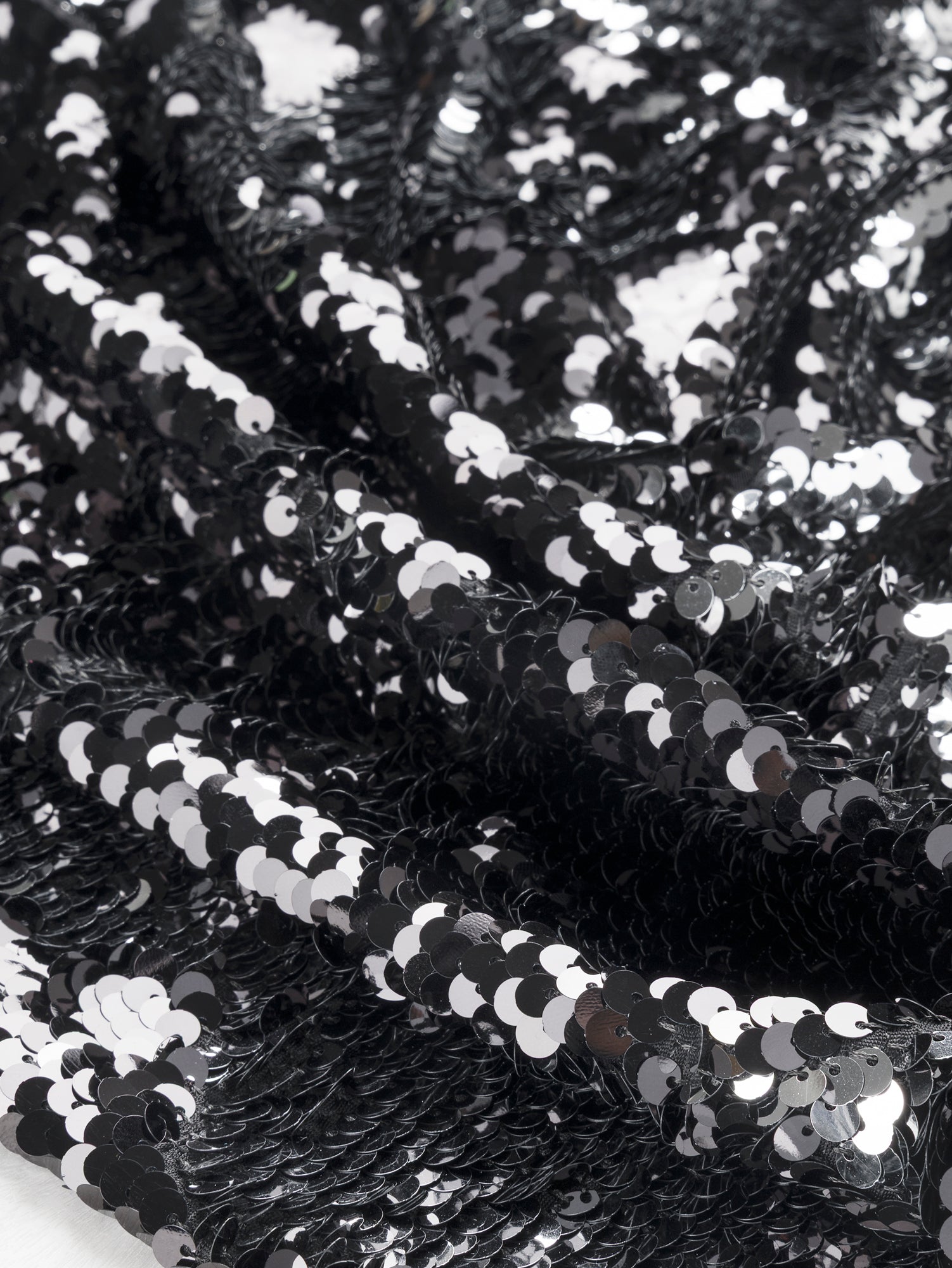 F-DEA102-Sequin-Slight-Stretch-Knit-Deadstock-Black-Core-Fabrics-scrunched.JPG