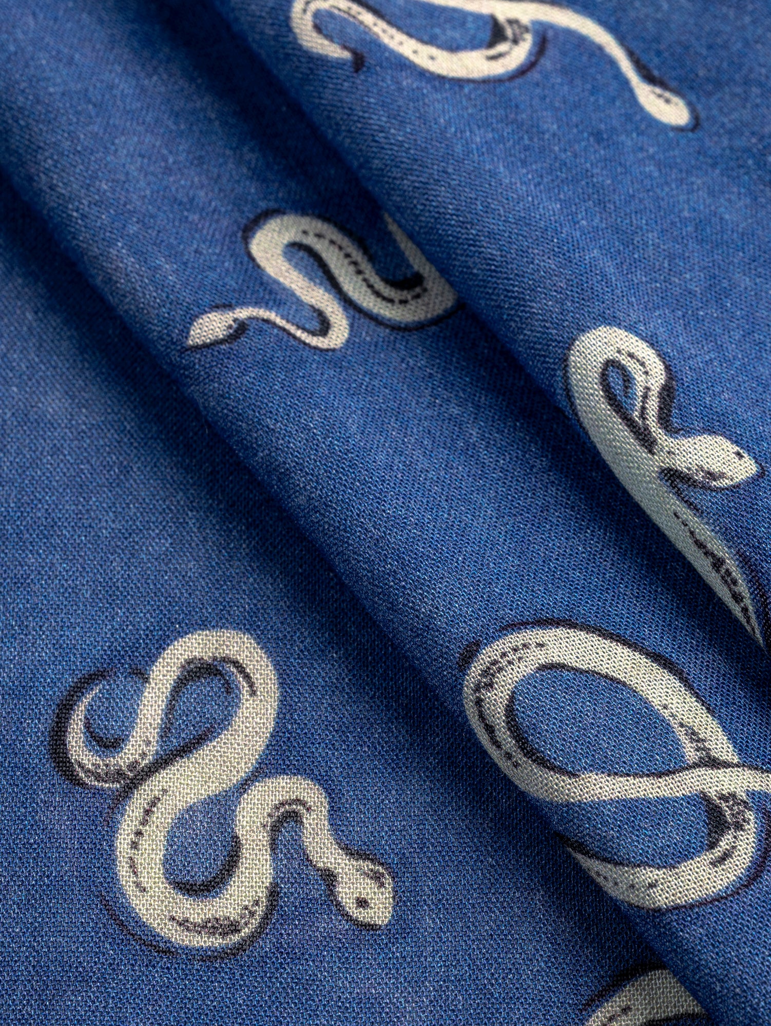 F-VIS273-Serpentine-Print-Viscose-Wool-Cerulean-Blue-Black-Cream-Fabrics-fold.JPG