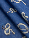 F-VIS273-Serpentine-Print-Viscose-Wool-Cerulean-Blue-Black-Cream-Fabrics-fold.JPG