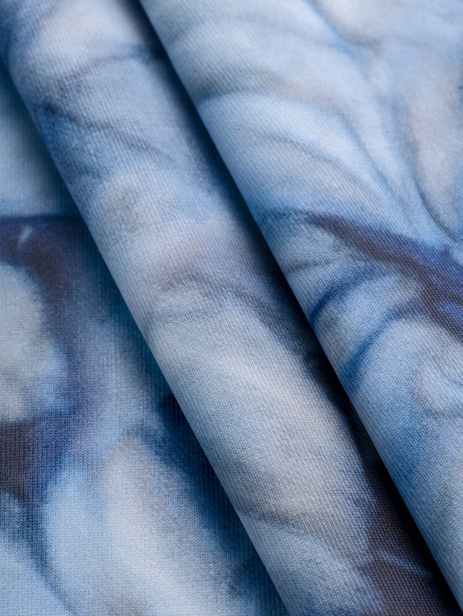 F-DEA135-Shibori-Print-Recycled-Polyester-Knit-Deadstock-Indigo-Core-Fabrics-fold.JPG